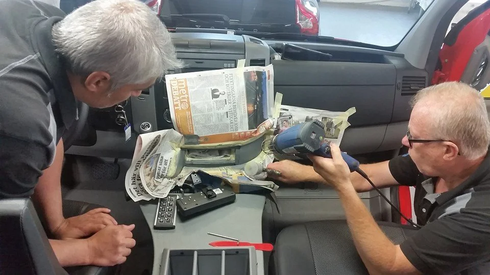 Color Glo specialists repairing hard plastic inside auto dash