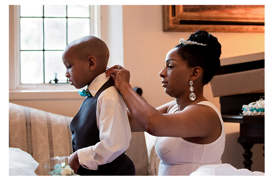 The bride helping her son get ready for the wedding. Precious!