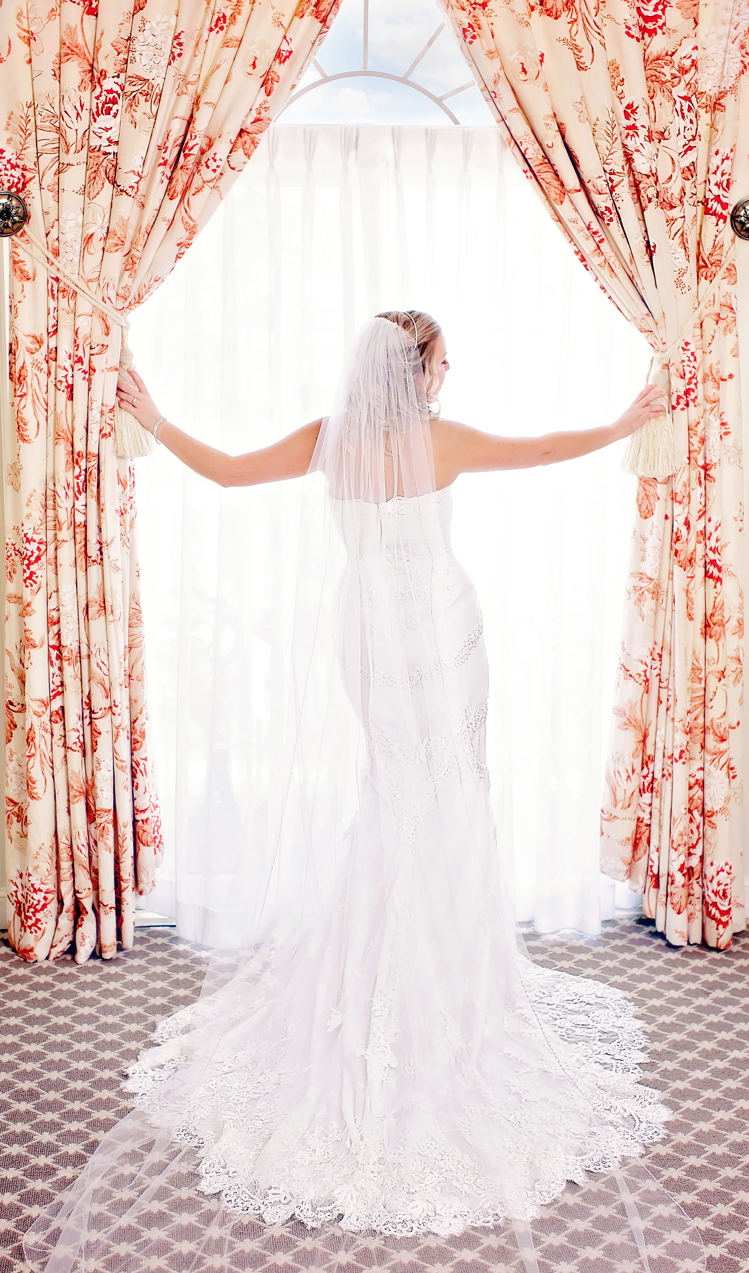 Bride at windows of Saybrook Point Inn and Spa, CT