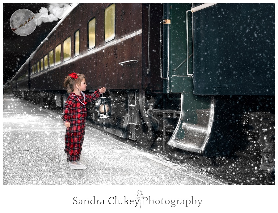 Child with lantern looks into train