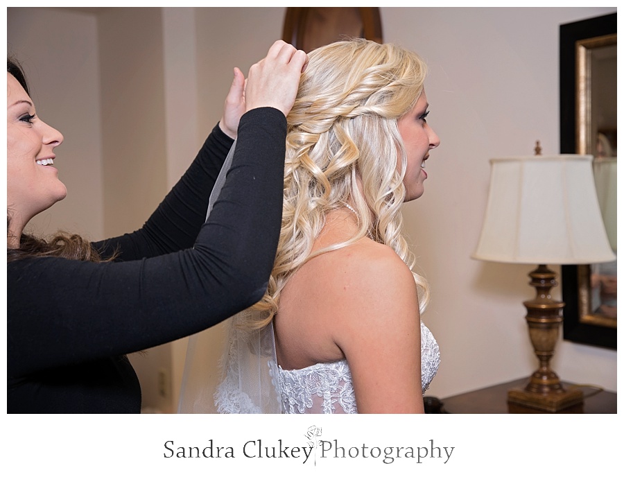 Bride getting hair fixed