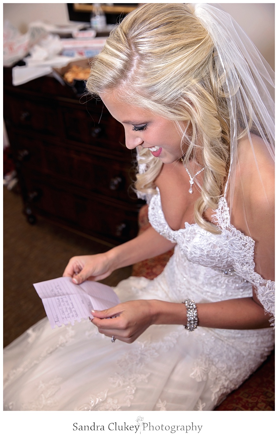 Bride reads letter from groom