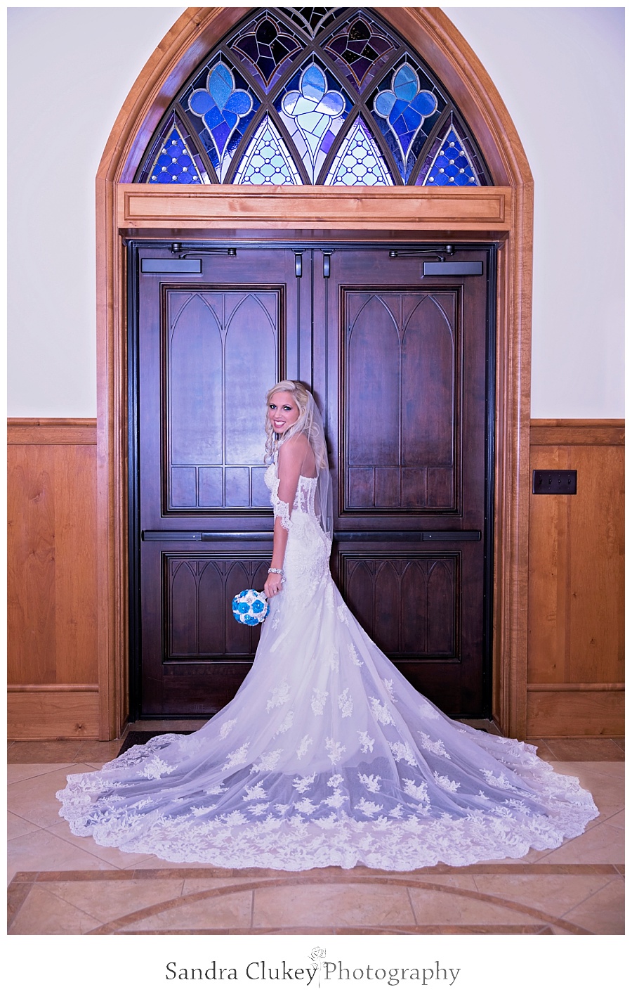 Bride stands at church doors