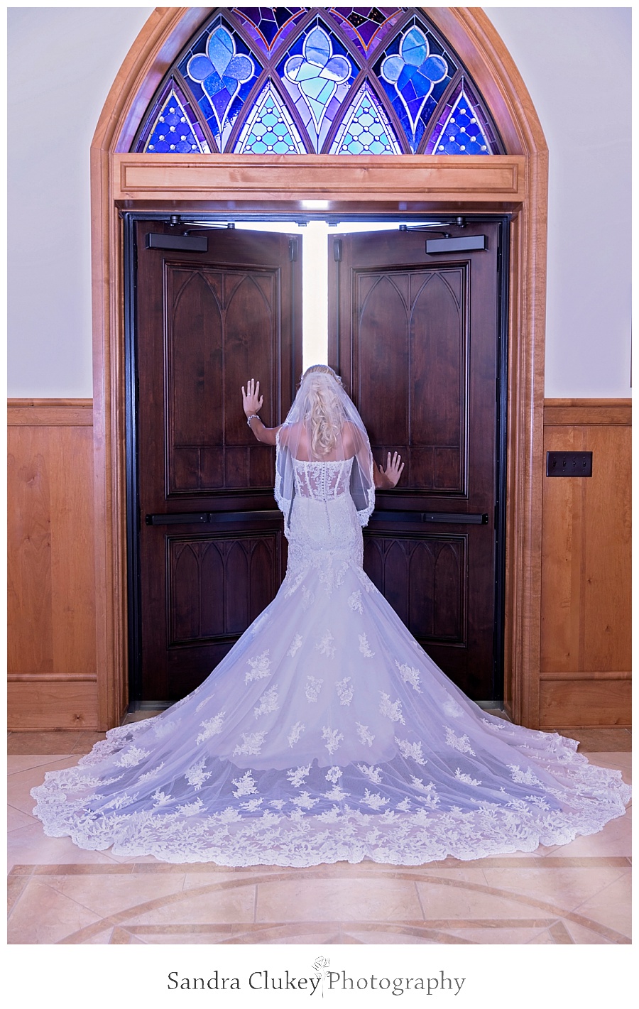 Bride at open church doors