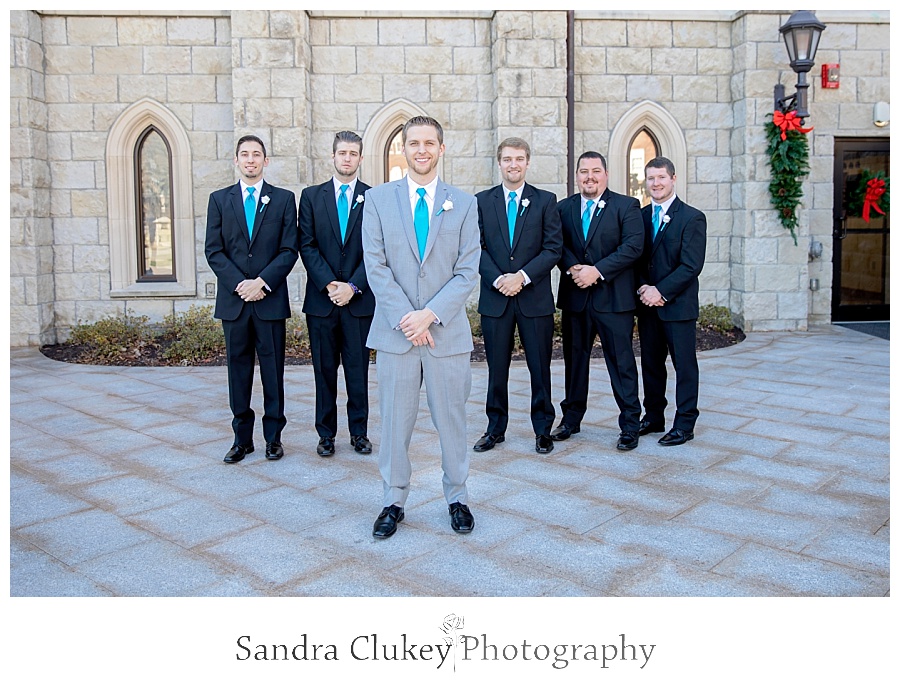 Groom stands in front of all his men