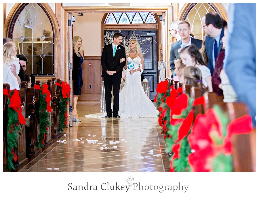 Bride walks down center isle