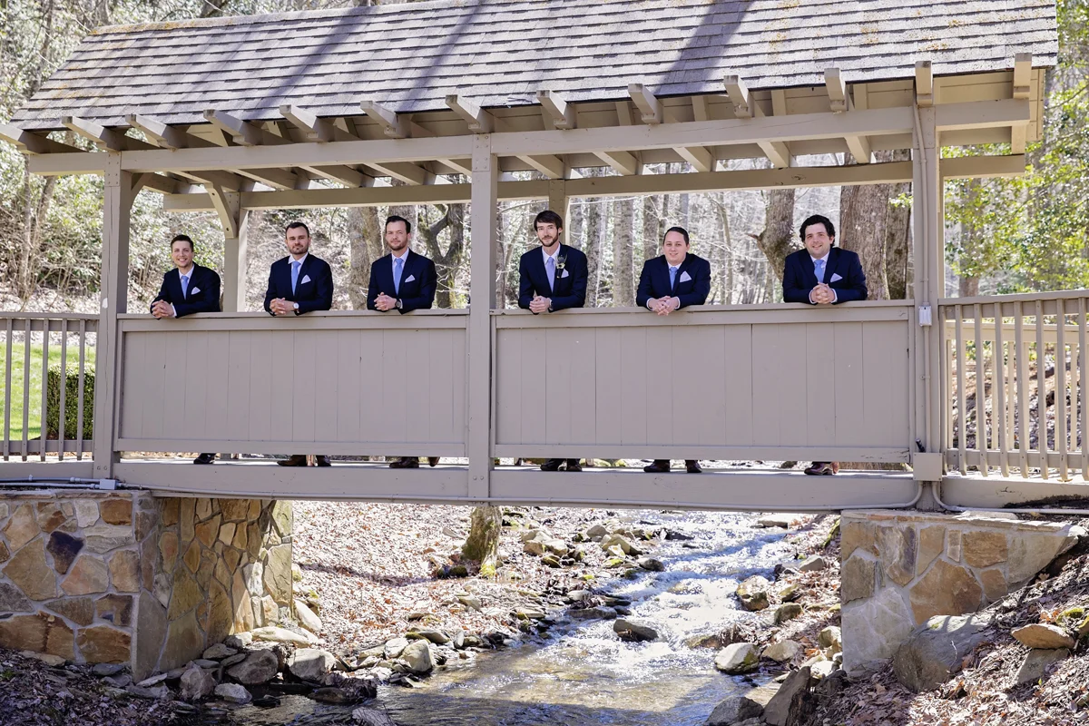 Groom on Covered Bridge at Hawkesdene House, Andrews NC