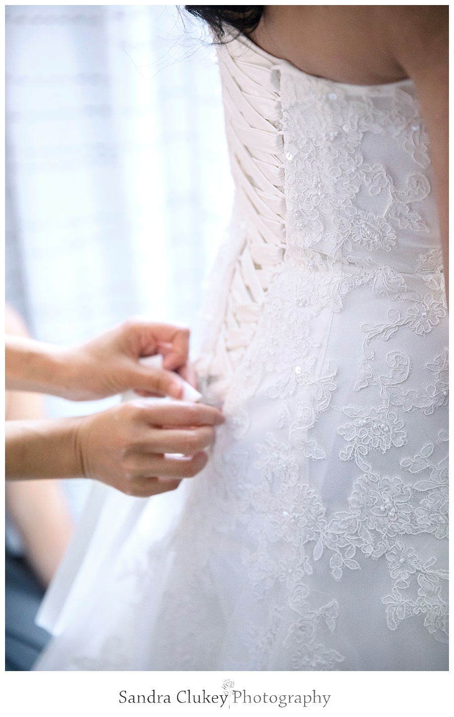 Tying brides dress