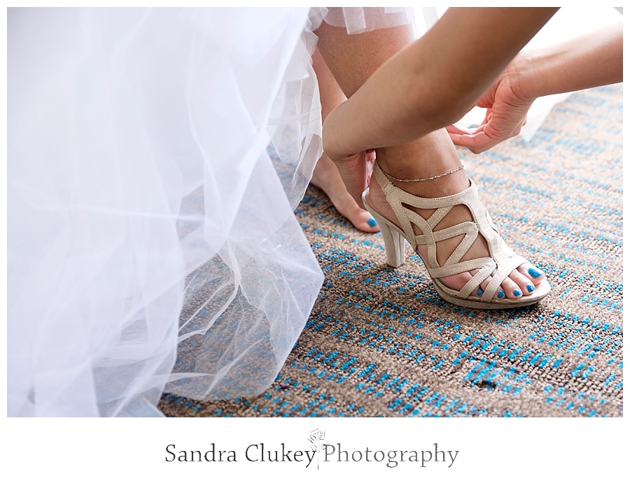 Bride puts on shoes