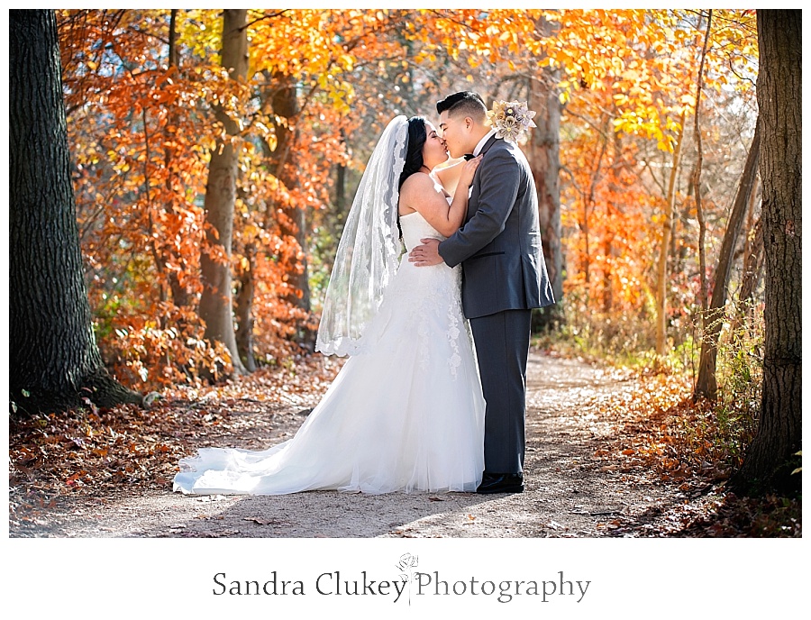 Glamorous couple on fall colored path