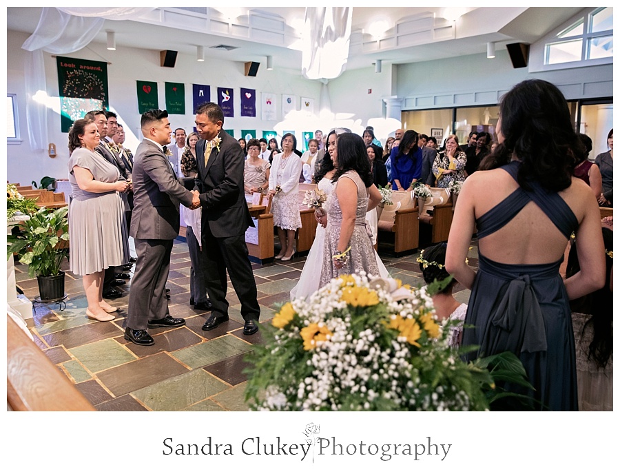 Dad congratulates the groom