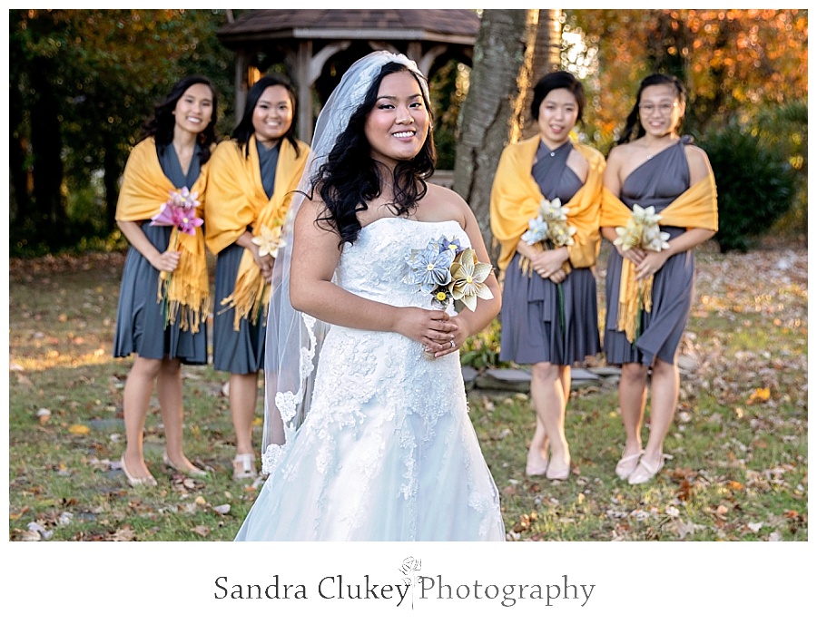 Isolated bride with girls looking on