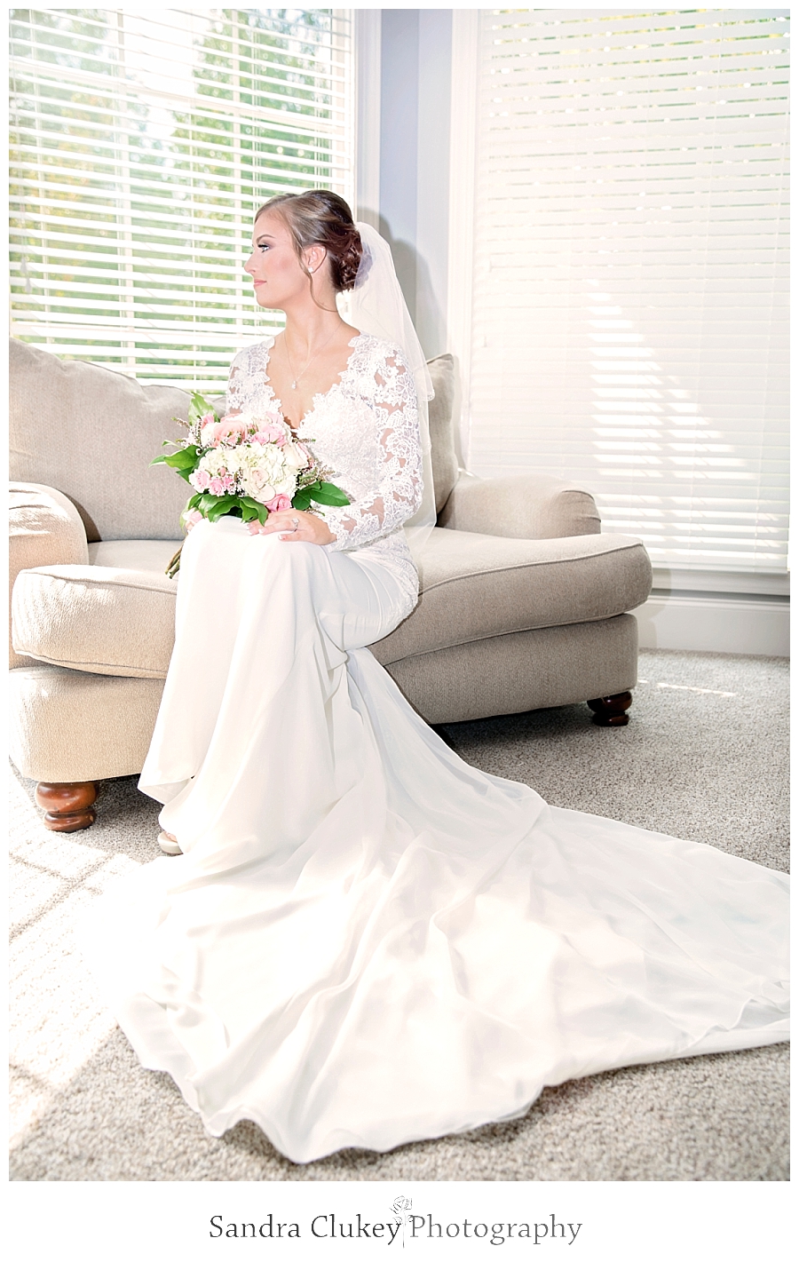 Exquisite bridal portrait of bride by window.