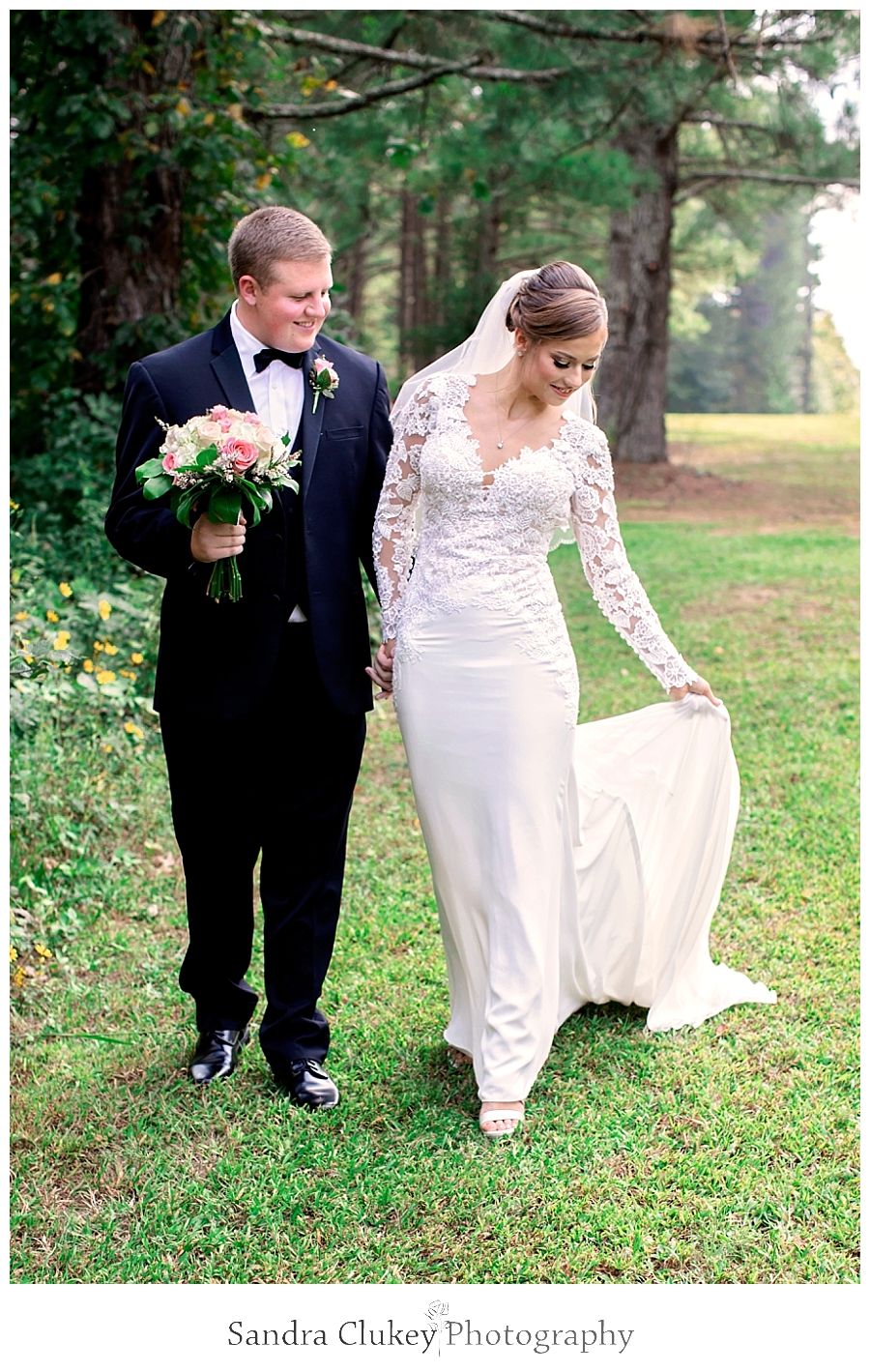  Bride and groom walking in Fletcher Park, Cleveland TN.  Copyright Sandra Clukey Photography, LLC  https://www.sandraclukeyphotography.com/ 