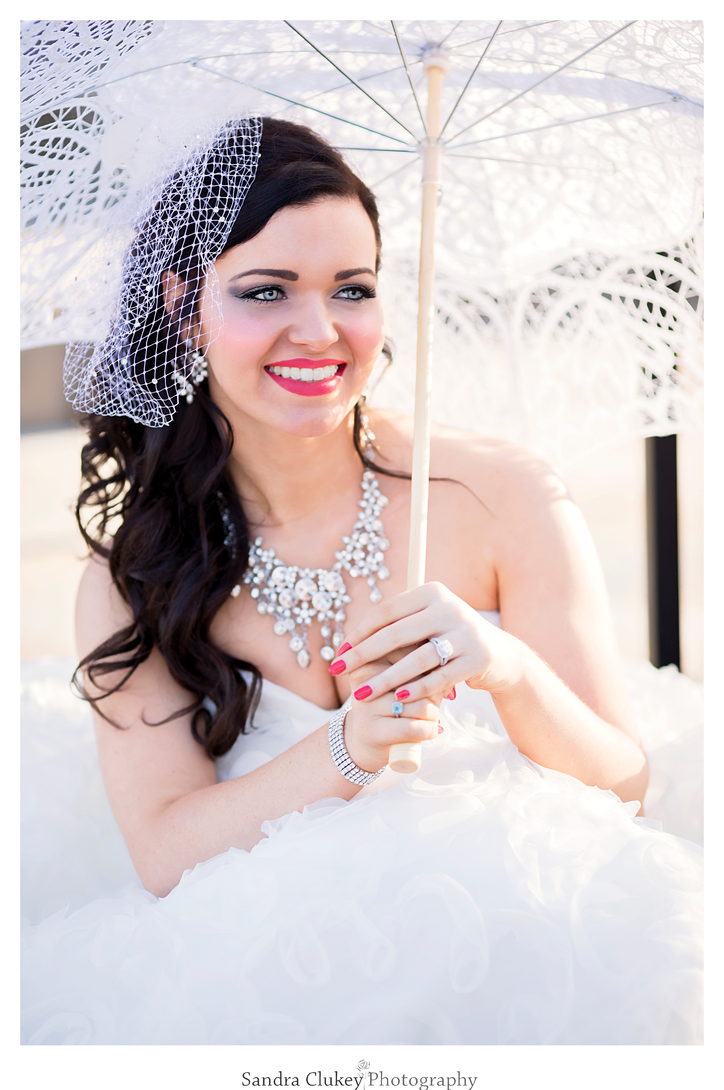 Lovely young bride with parasol at Lee University Chapel, Cleveland TN