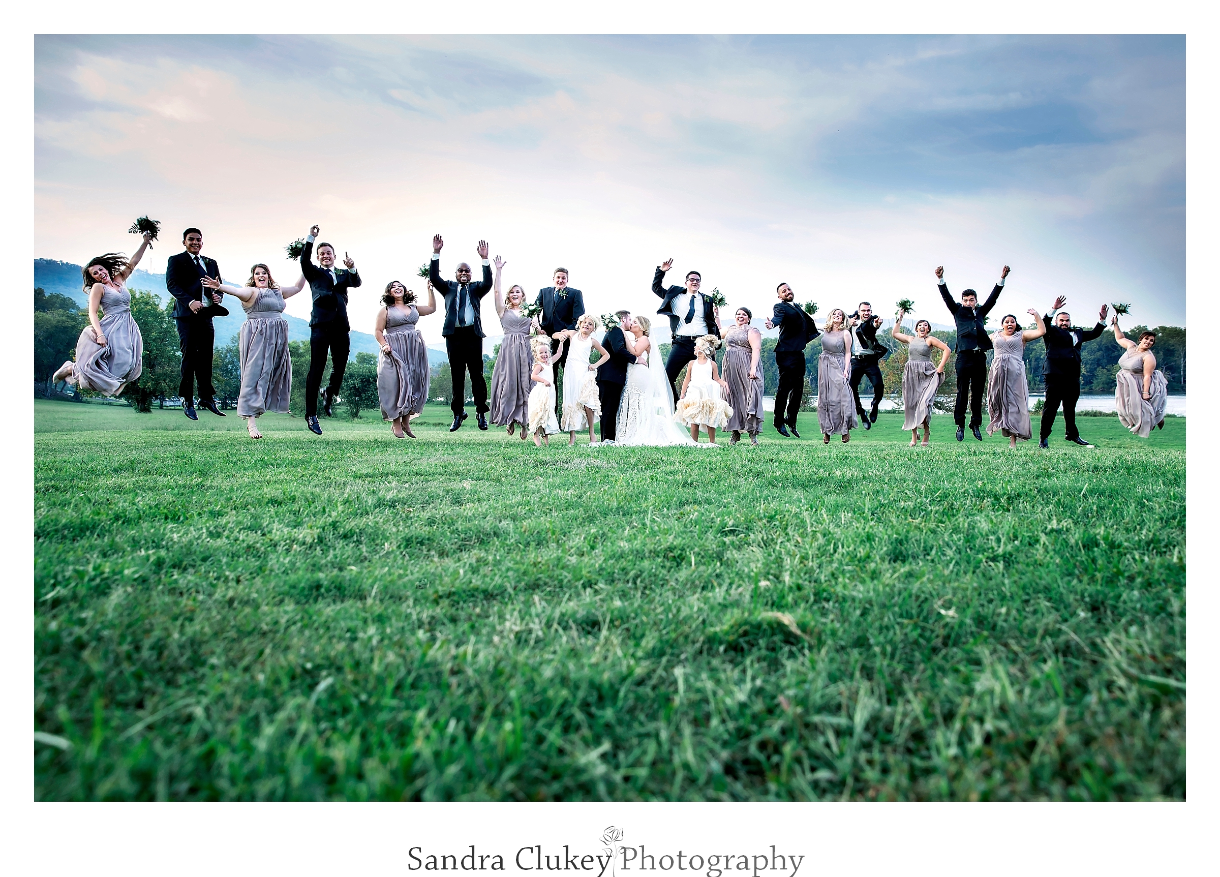 Wedding party jump at Tennessee RiverPlace, Chattanooga TN