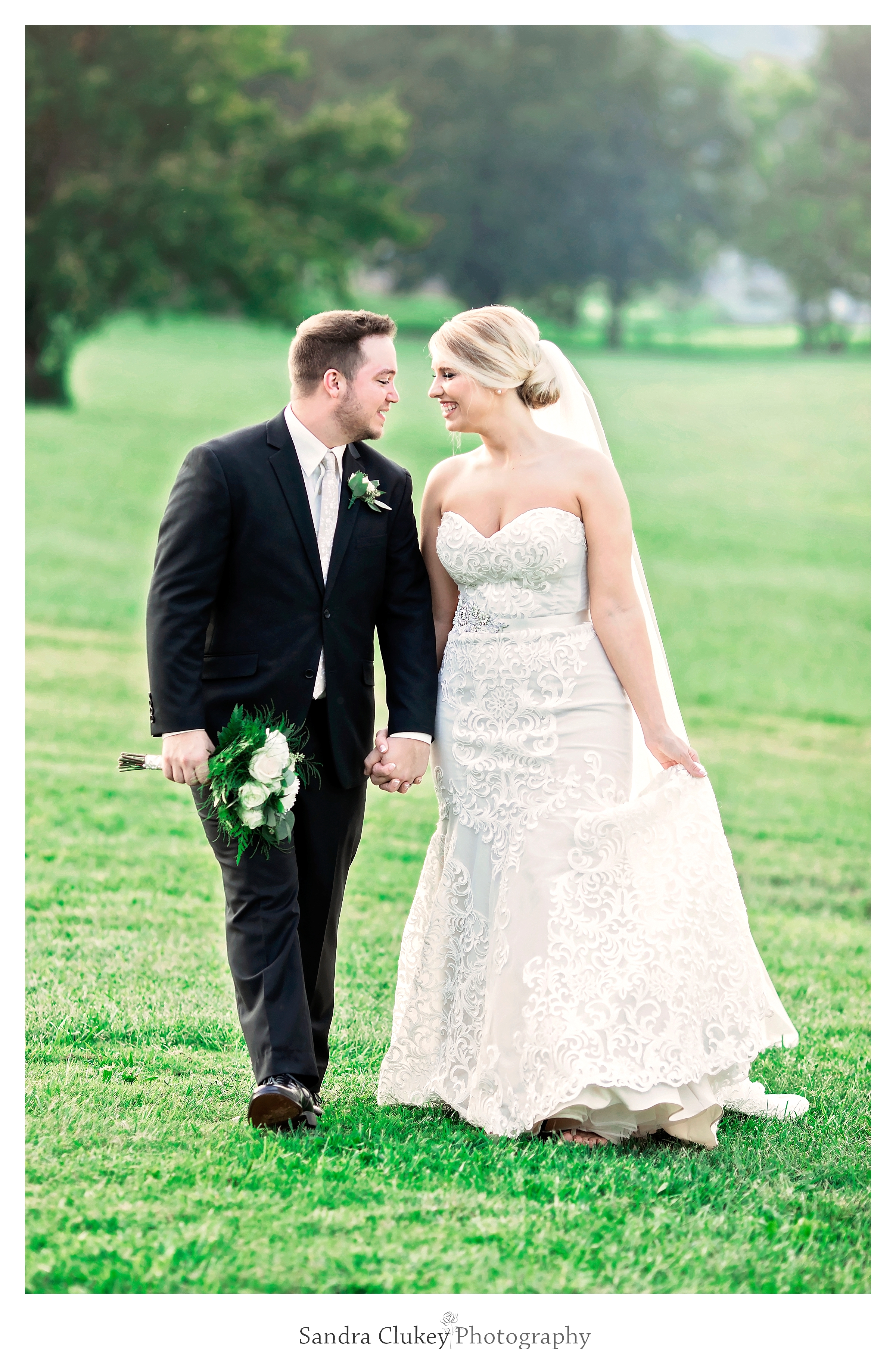 Bride and groom walk together at Tennessee RiverPlace, Chattanooga TN