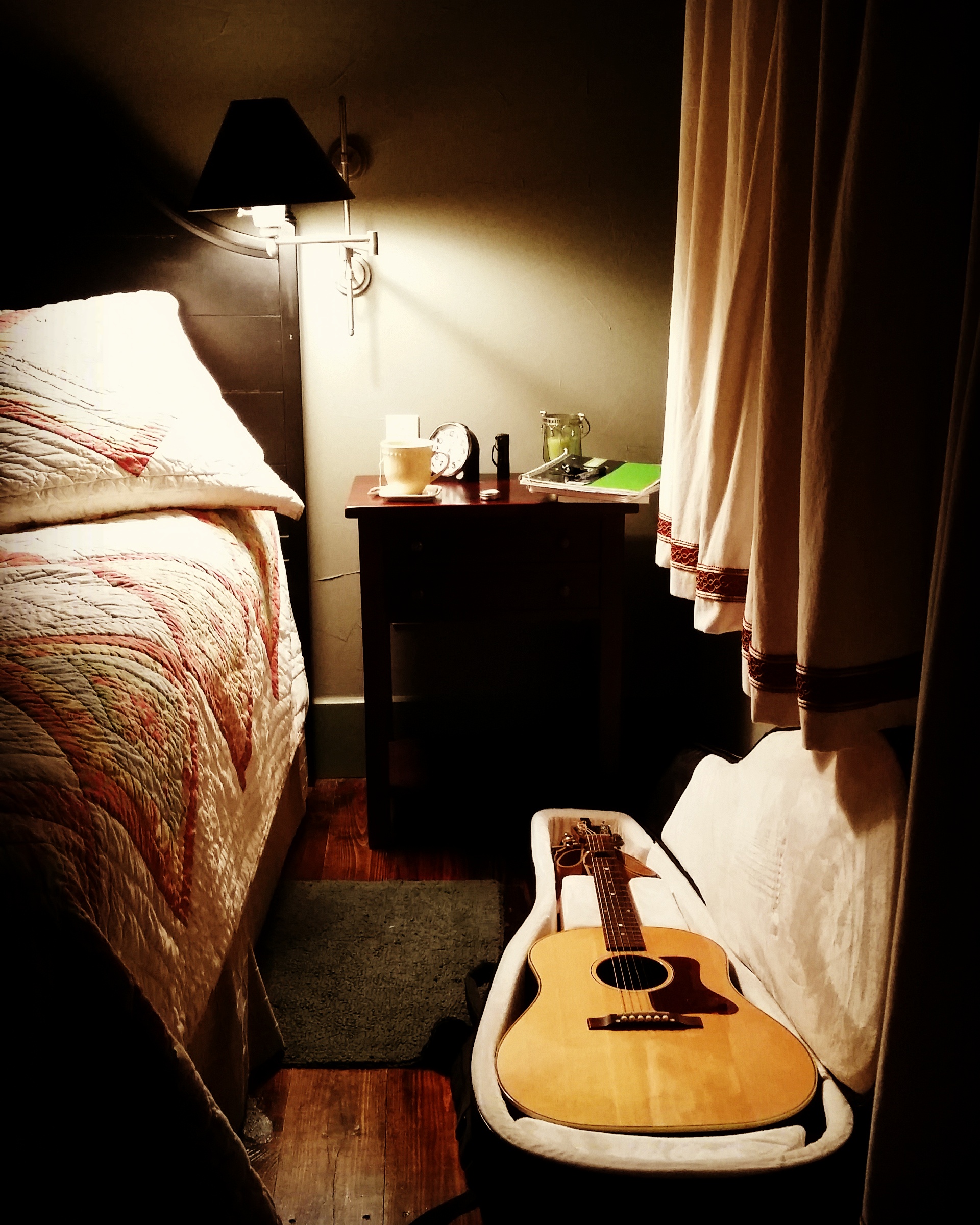 Happiness is... a quiet cabin, a bed with a quilt, and my guitar.