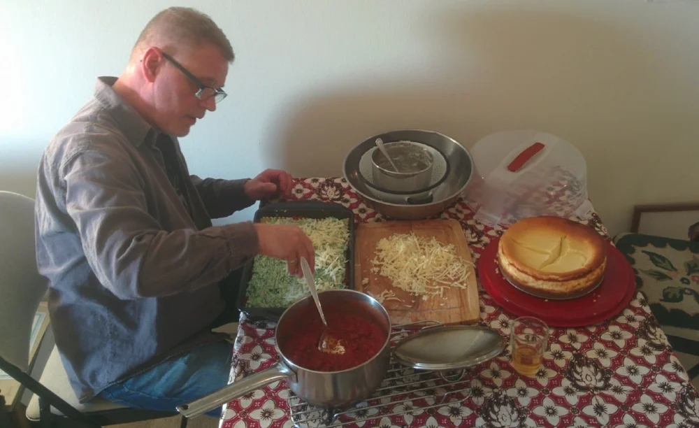 My dad busy making my sister’s lasagna and cherry cheesecake for her birthday last year.