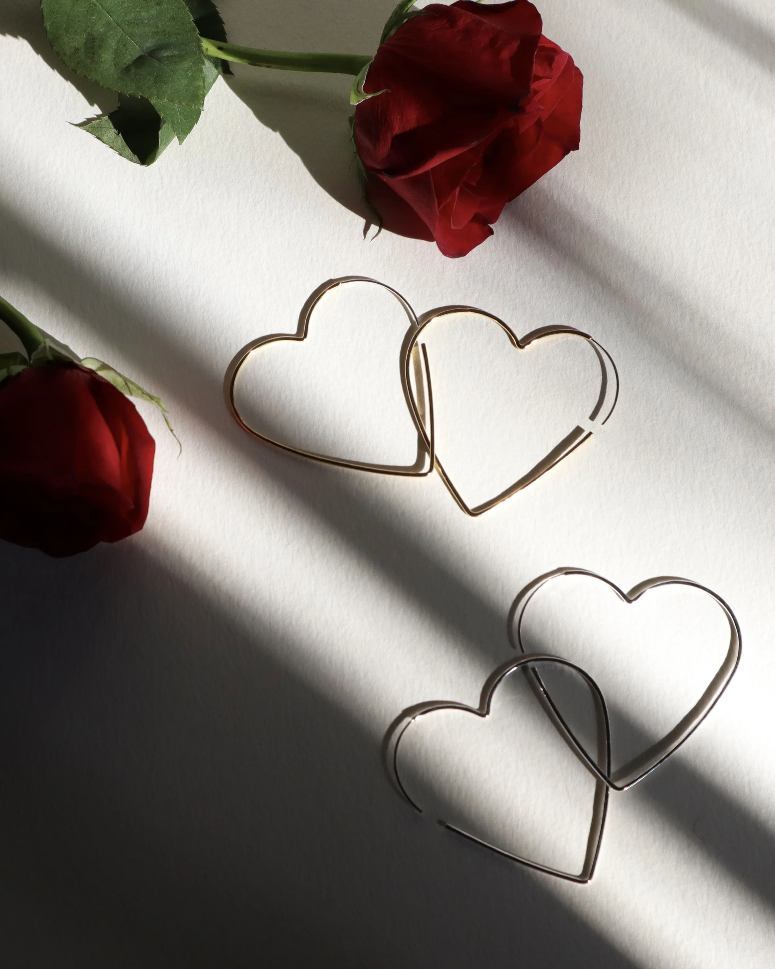 vertical big heart hoops silver and brass.JPG