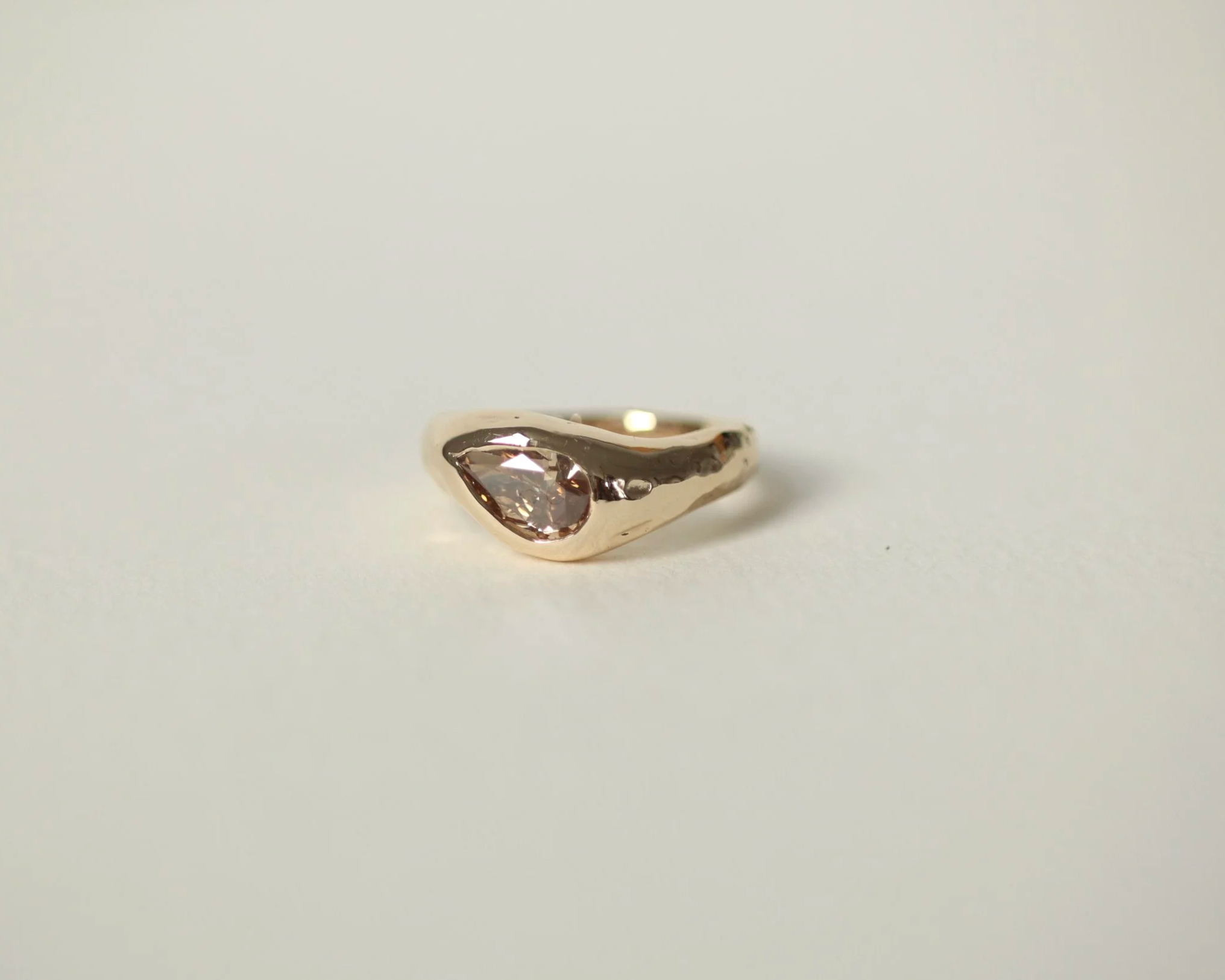 Gold sculptural engagement ring with brown fancy pear cut diamond for Deminica