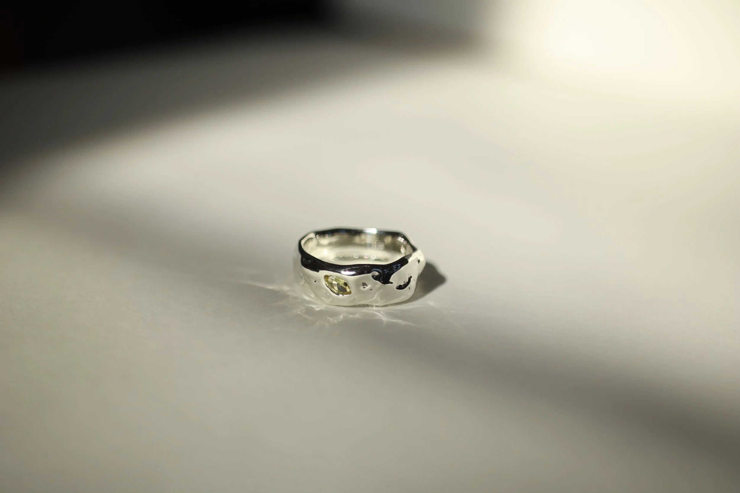 Silver sculptural band with yellow lab marquise cut sapphire for Hamdi