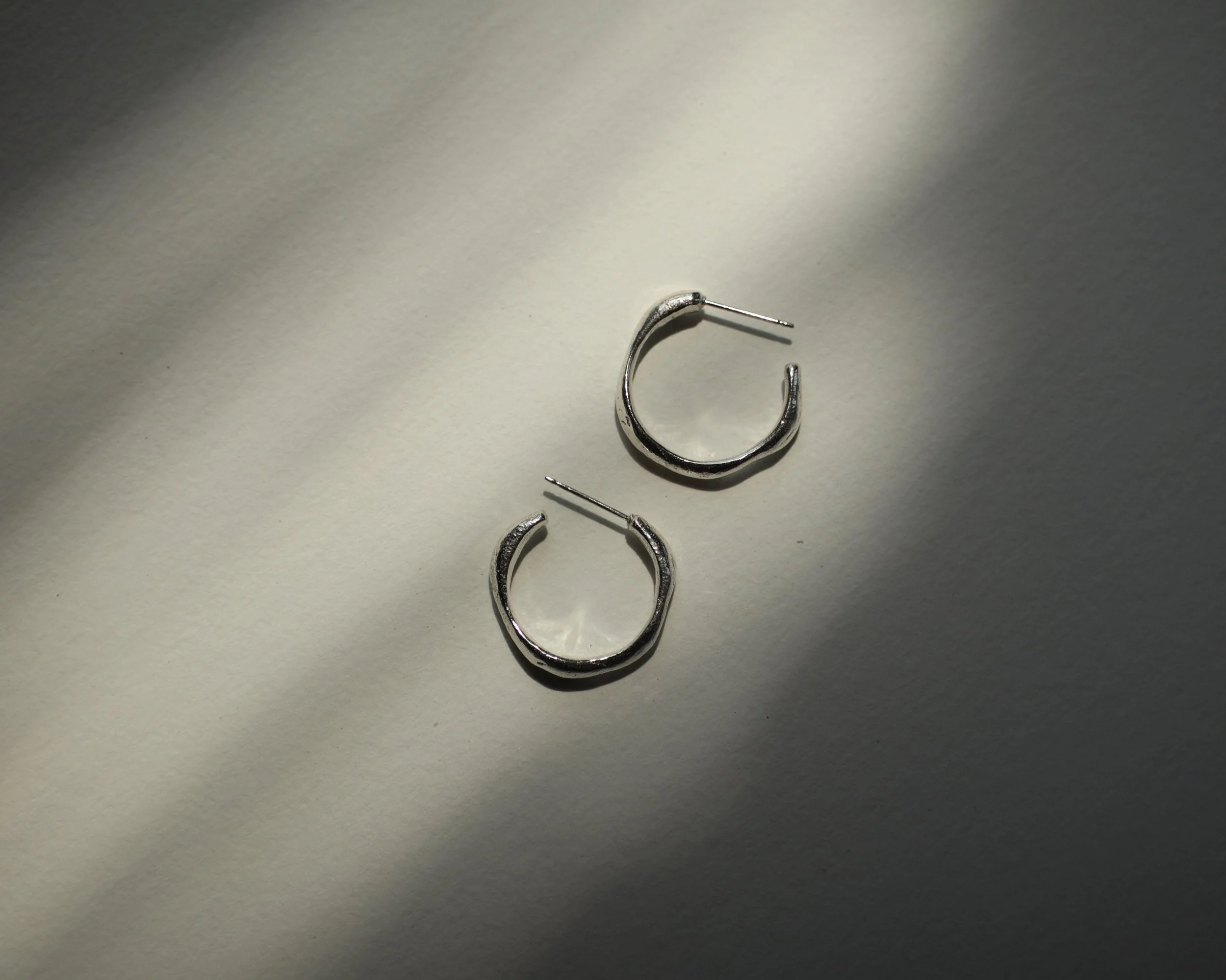 sand cast hoops in contrast Sophie Kissin Jewelry.JPG