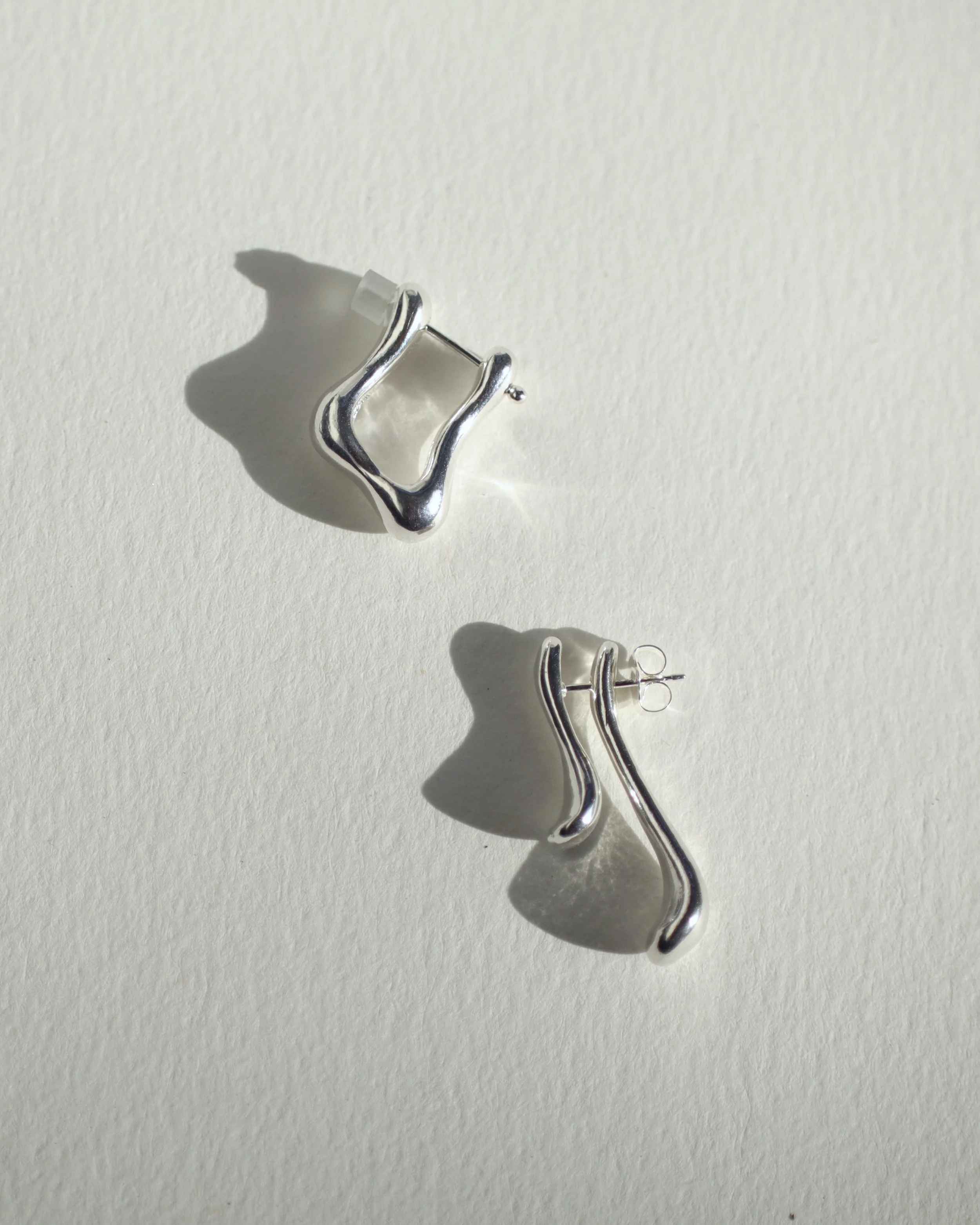 swoop set flatlay on white Sophie Kissin Jewelry.JPG