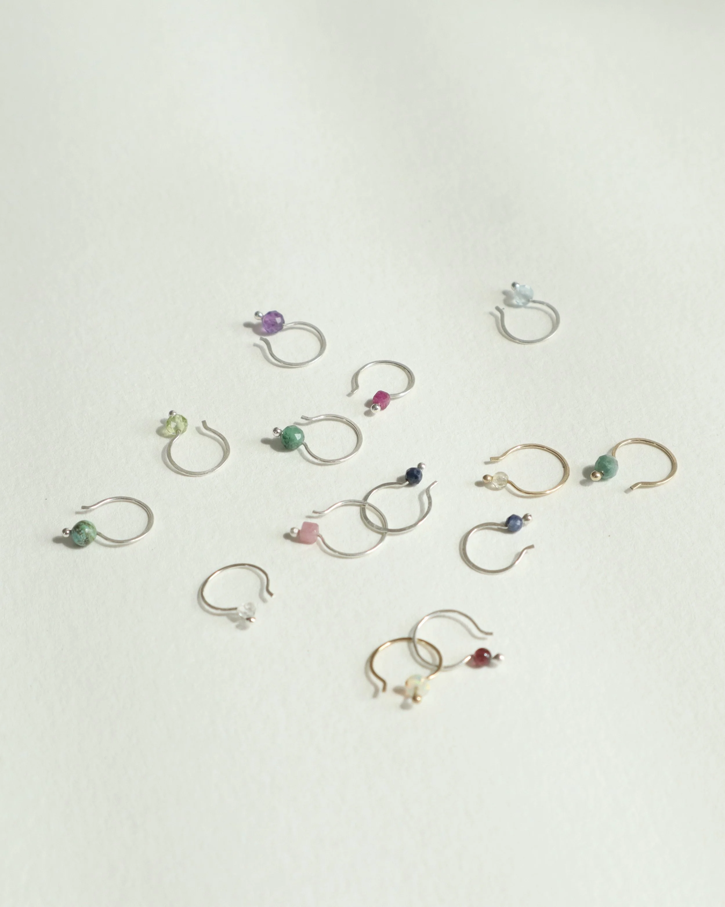 birthstone hoops laying about Sophie Kissin Jewelry.JPG