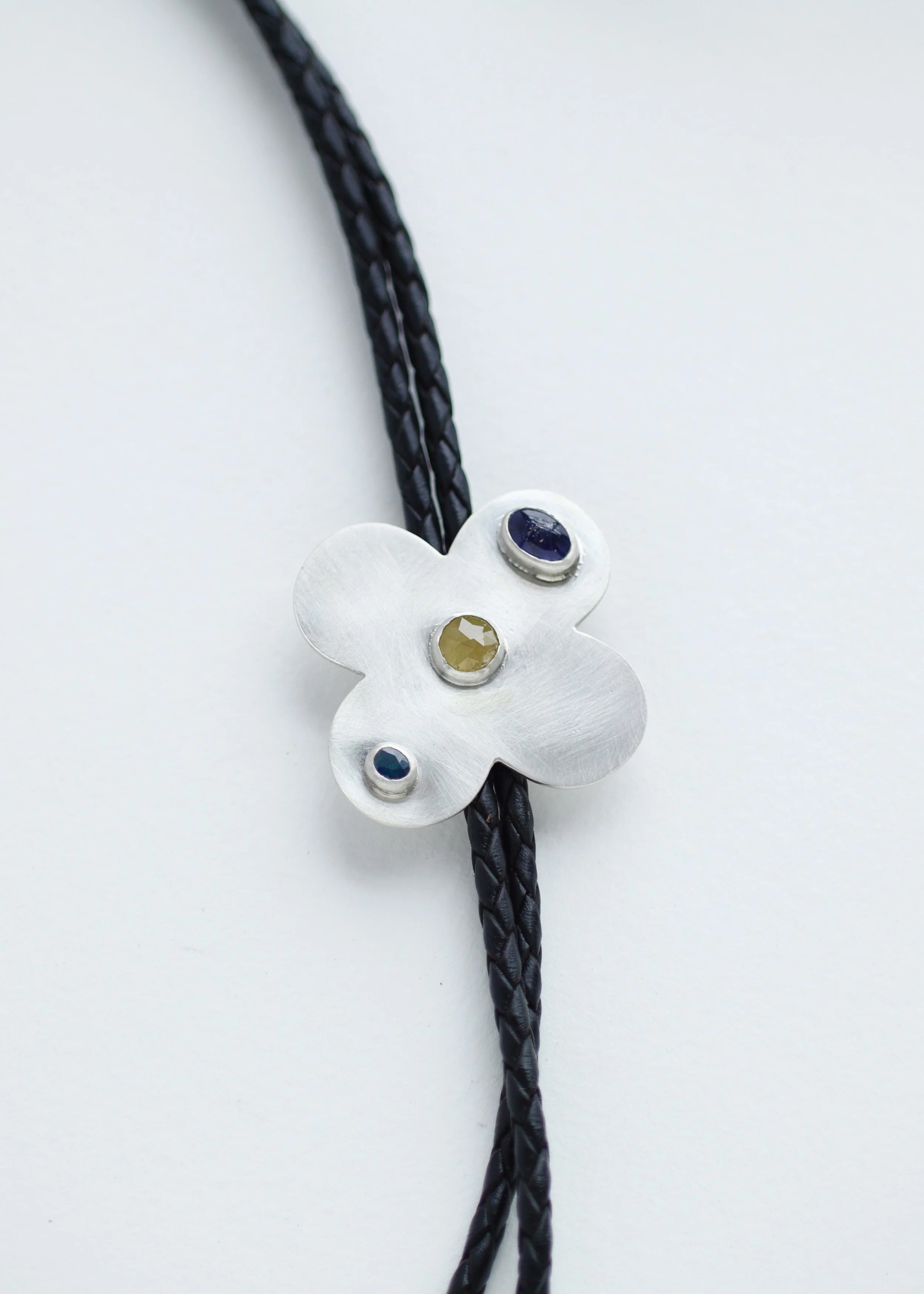 close up of quatrefoil bolo tie.JPG