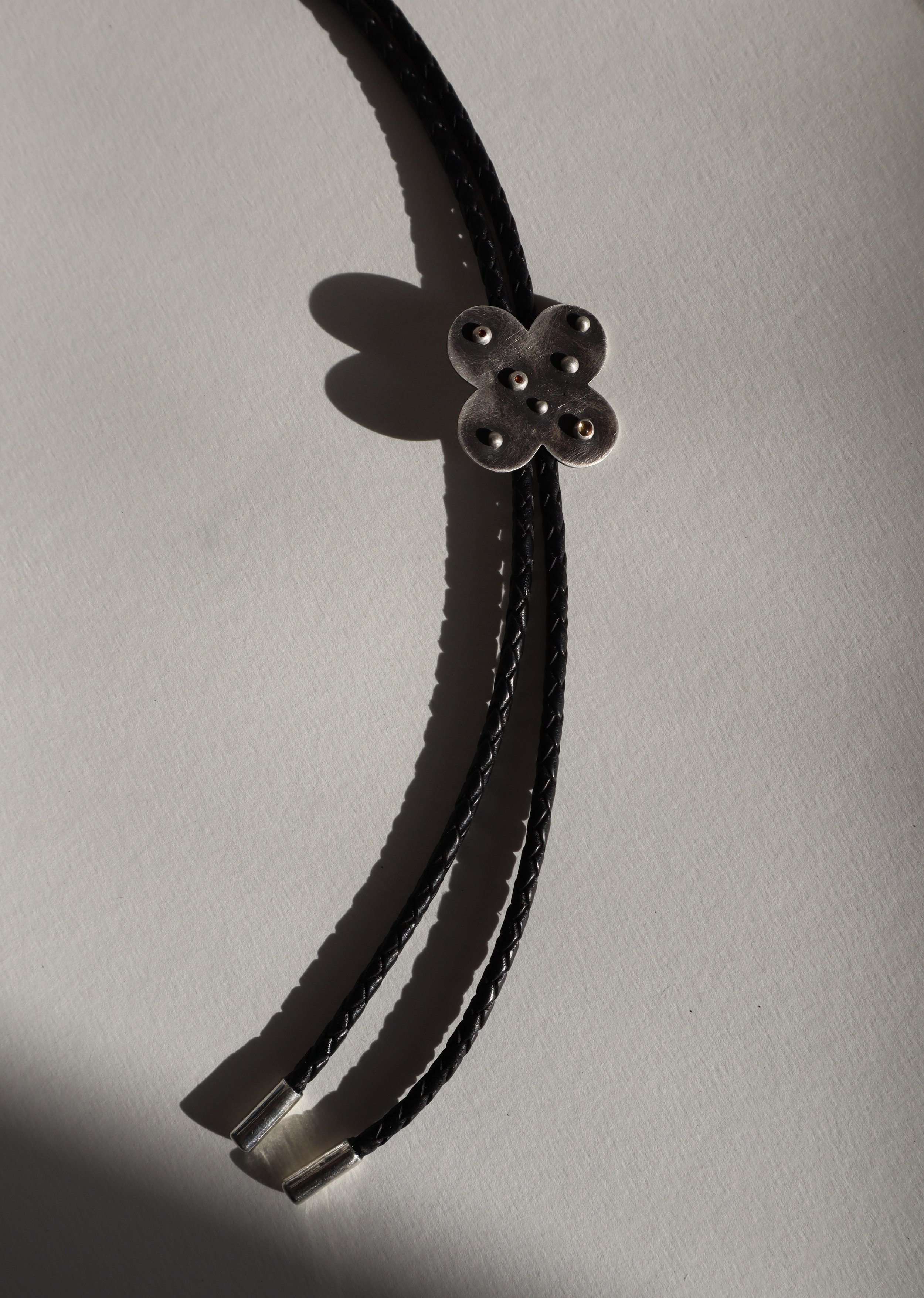Citrine-studded Silver Quatrefoil Bolo Tie