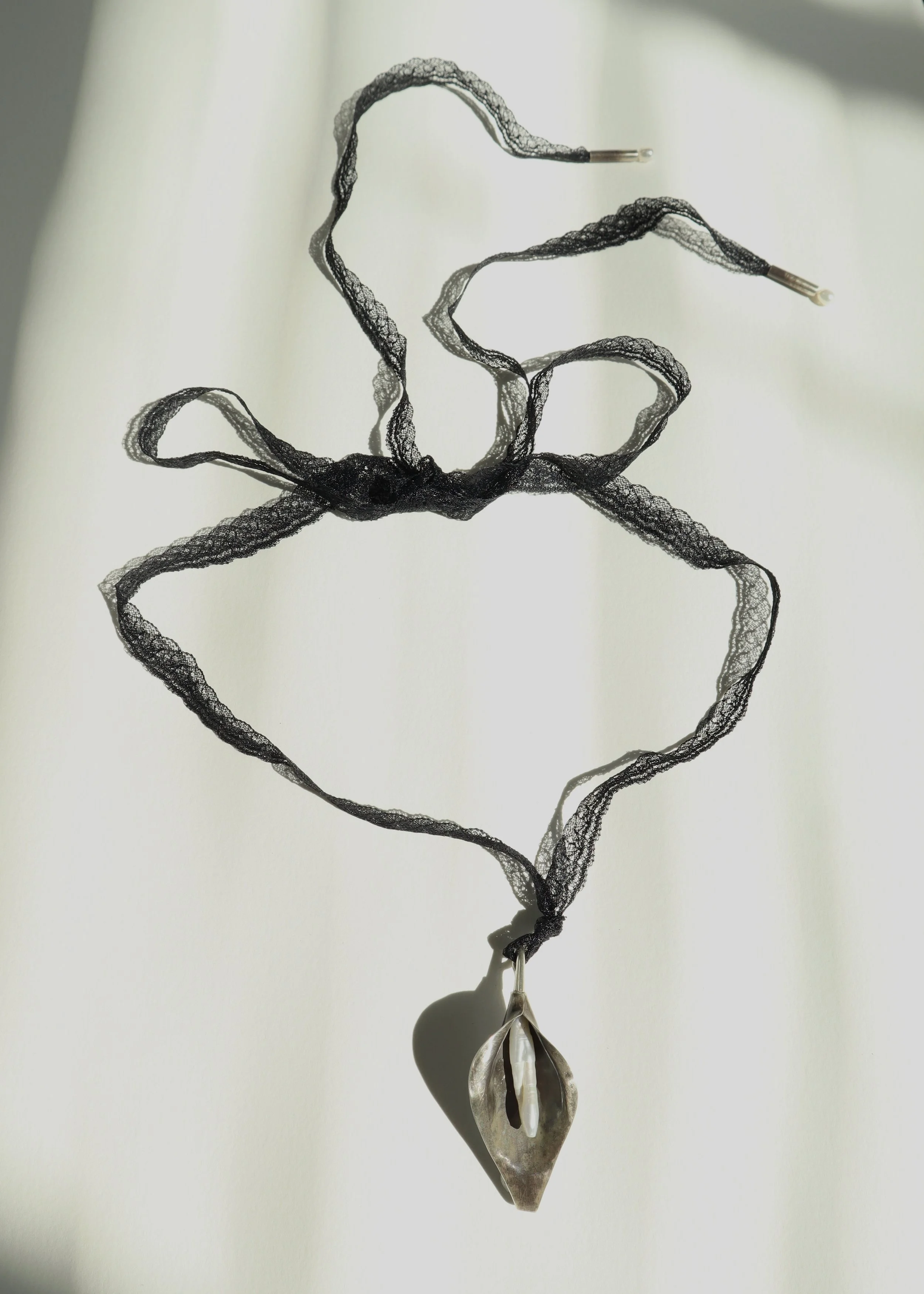 black lace calla lily tie necklace in bow Sophie Kissin Jewelry.JPG