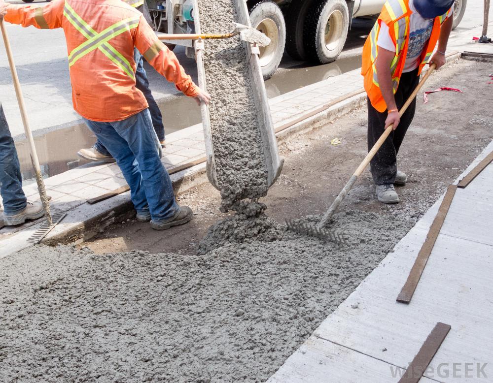 men-in-orange-and-yellow-vests-working-with-cement.jpg