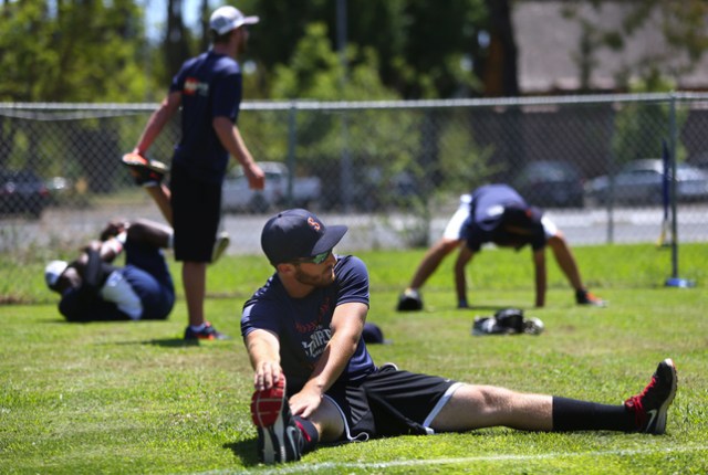 Sonoma Stompers pitcher Sean Conroy stretches during practice Tuesday at Arnold Field in Sonoma. Conroy, 23, of Clifton Park, N.Y., is the first openly gay player to enter the professional baseball ranks, according to the Stompers. Christopher Chung//AP via The Press Democrat