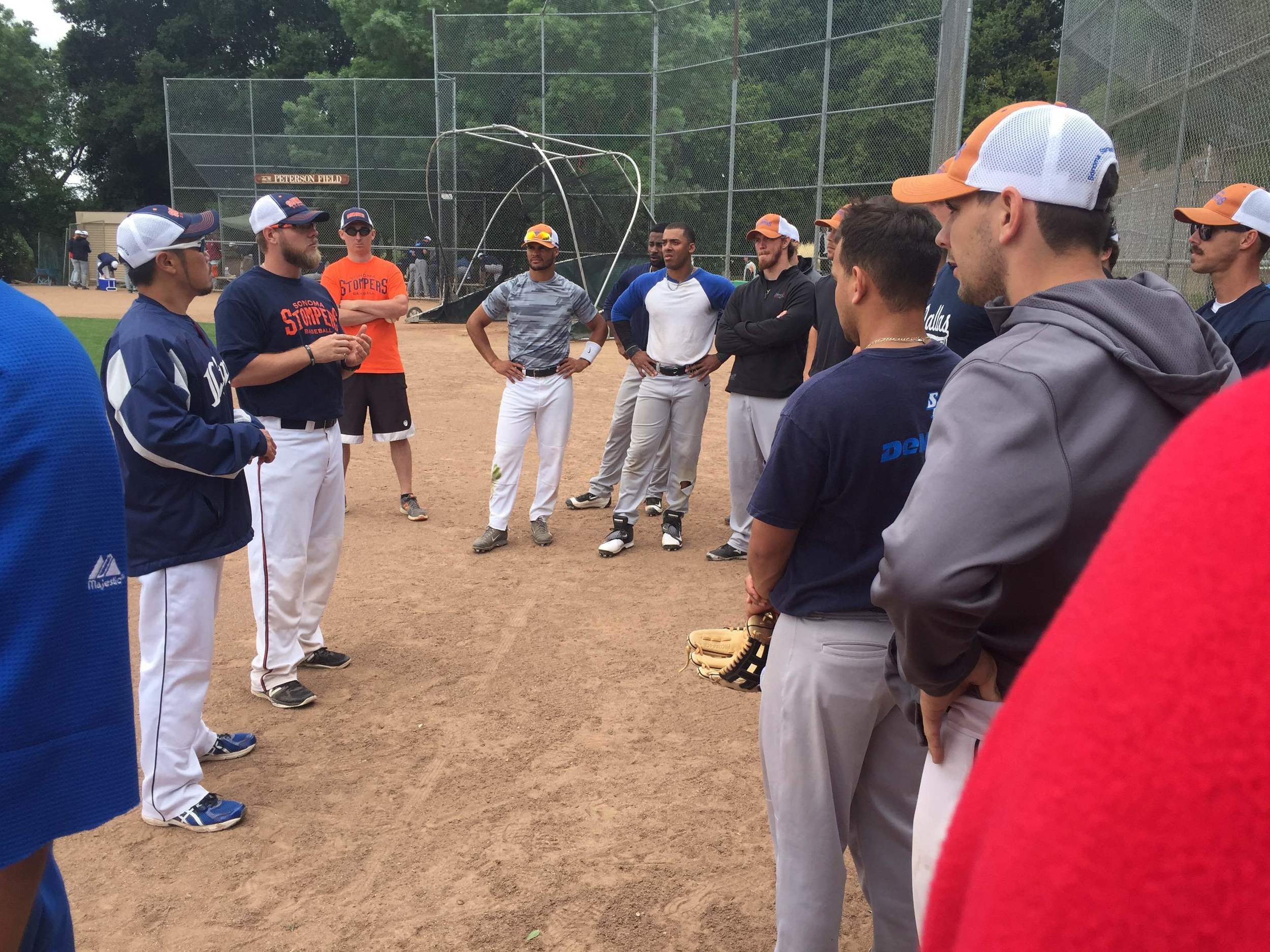 Manager Takashi Miyoshi and bench coach Chris Mathews address the team. Tim Livingston/Sonoma Stompers