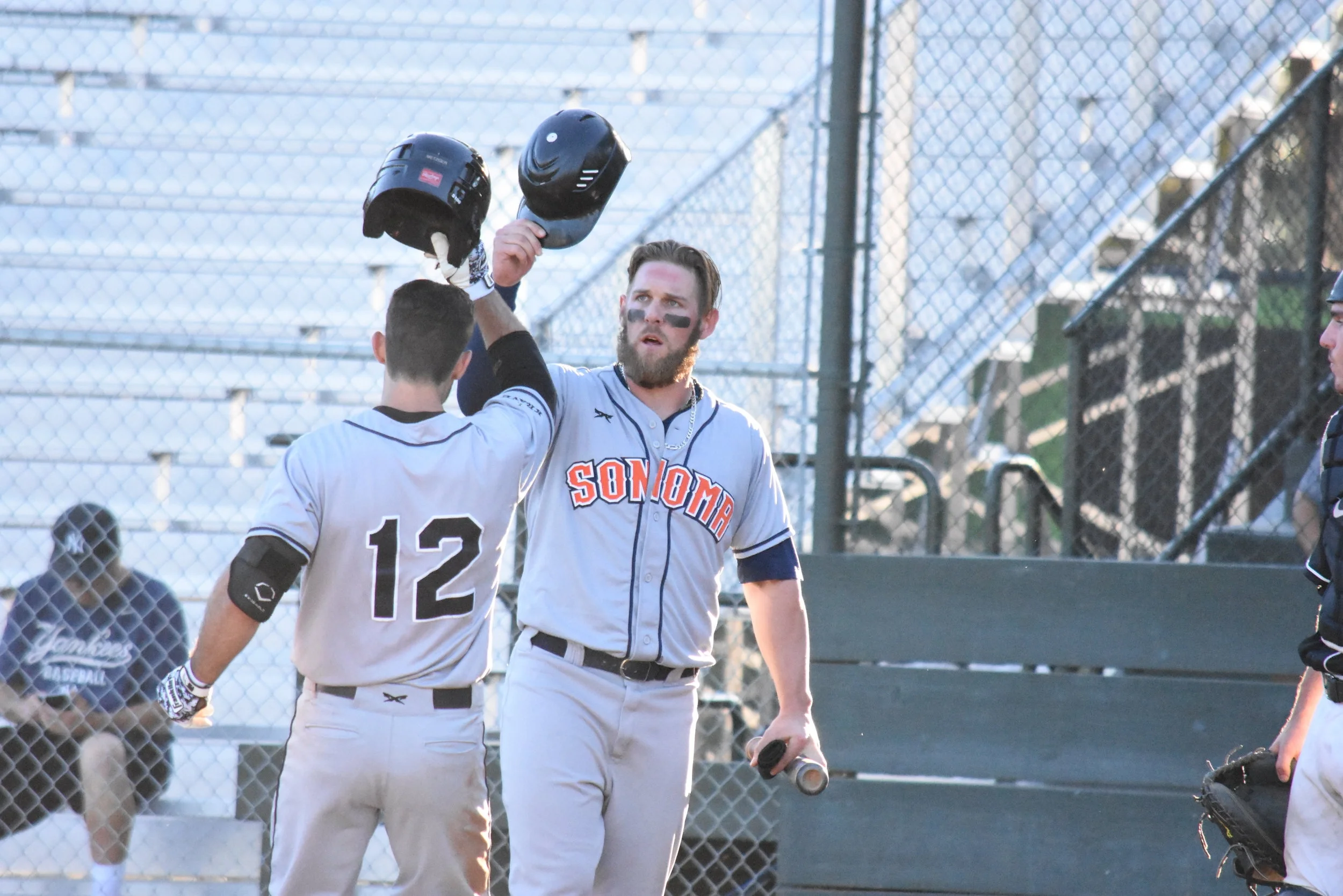 Brennan Metzger (left) hit a home run in the eighth inning of Saturday night's 7-5 win over the Pittsburg Diamonds, securing the Sonoma Stompers' first series victory of the season. (James W. Toy III / Sonoma Stompers)