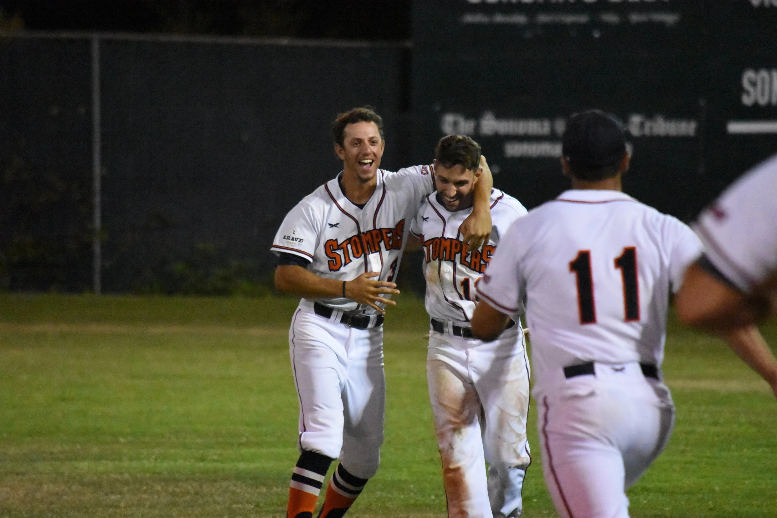 Matt LoCoco (left) and Brennan Metzger (right) celebrate after Metzger hit a game-winning single to defeat the Pittsburg Diamonds 6-5 at Peoples Home Equity Ballpark on Saturday. (James W. Toy III / Sonoma Stompers)