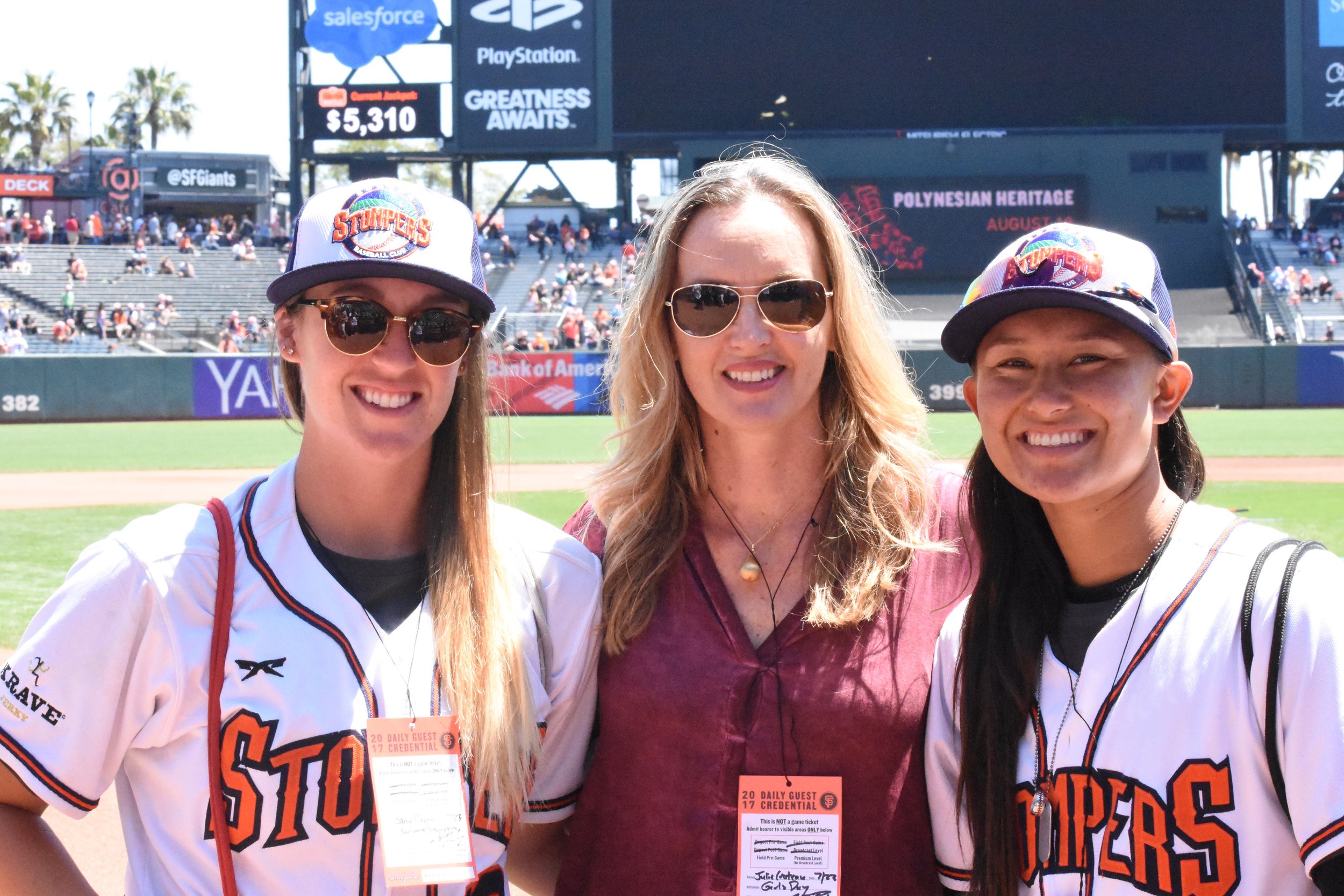  Stacy Piagno (left) and Kelsie Whitmore (right) pose with Julie Croteau, the first woman to play men's NCAA baseball, on the field at AT&amp;T Park on Sunday. (James W. Toy III / Sonoma Stompers) 