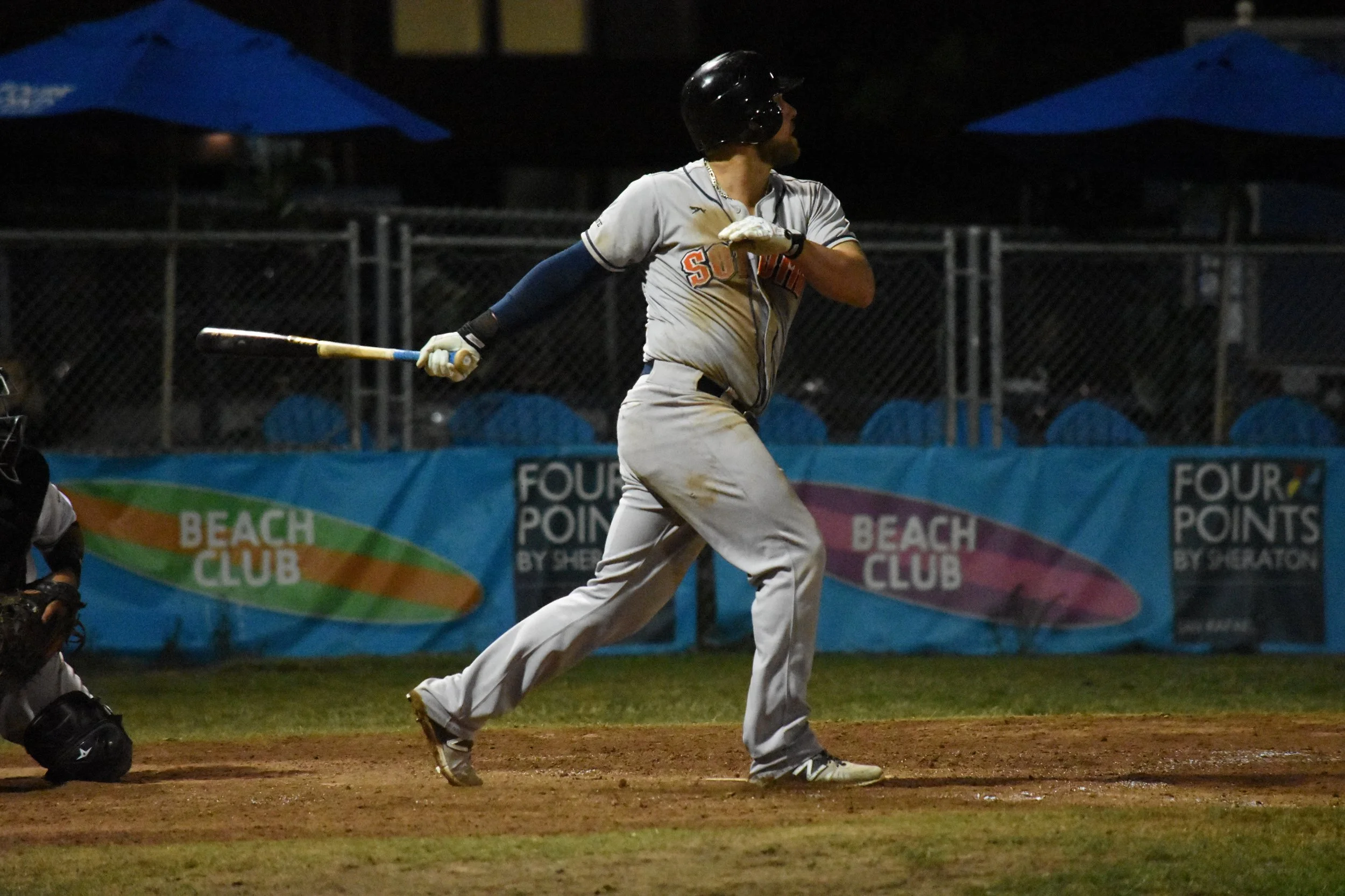 Scott David hits an RBI single to give the Sonoma Stompers a three-run lead against the San Rafael Pacifics in the tenth inning on Thursday at Albert Park. (James W. Toy III / Sonoma Stompers)