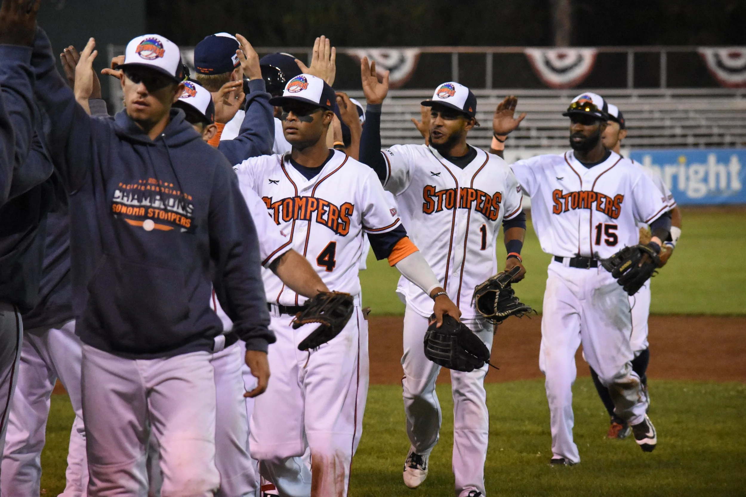 The Sonoma Stompers celebrate on the field at Peoples Home Equity Ballpark after securing a 6-5 win over the Vallejo Admirals in their last regular season home game on Sunday. (James W. Toy III / Sonoma Stompers)