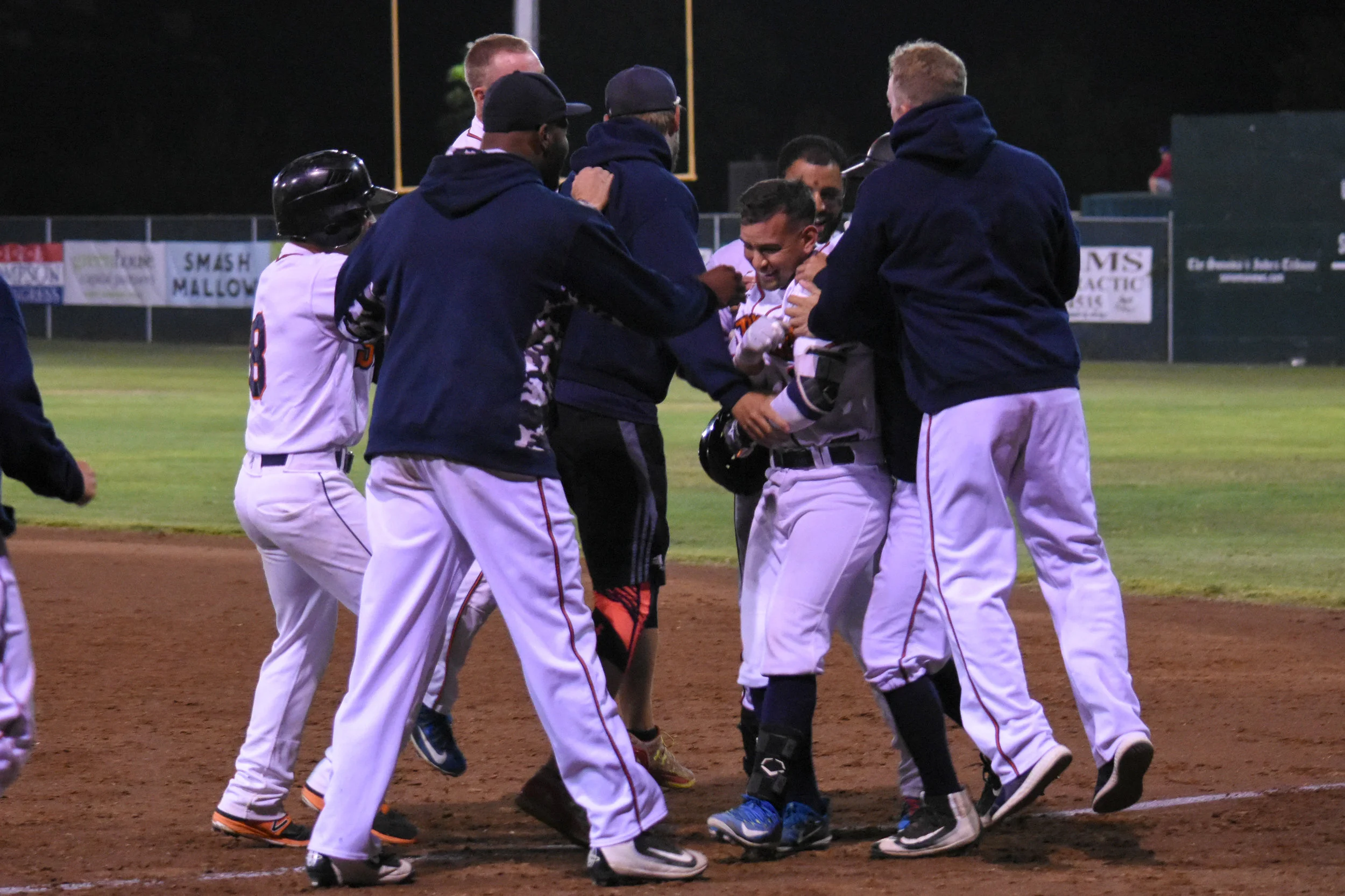 Eddie Mora-Loera celebrates with his teammates after the Sonoma Stompers’ walk-off win in their game against the San Rafael Pacifics, July 31, 2018 in Sonoma, Calif. (James W. Toy III / Sonoma Stompers)