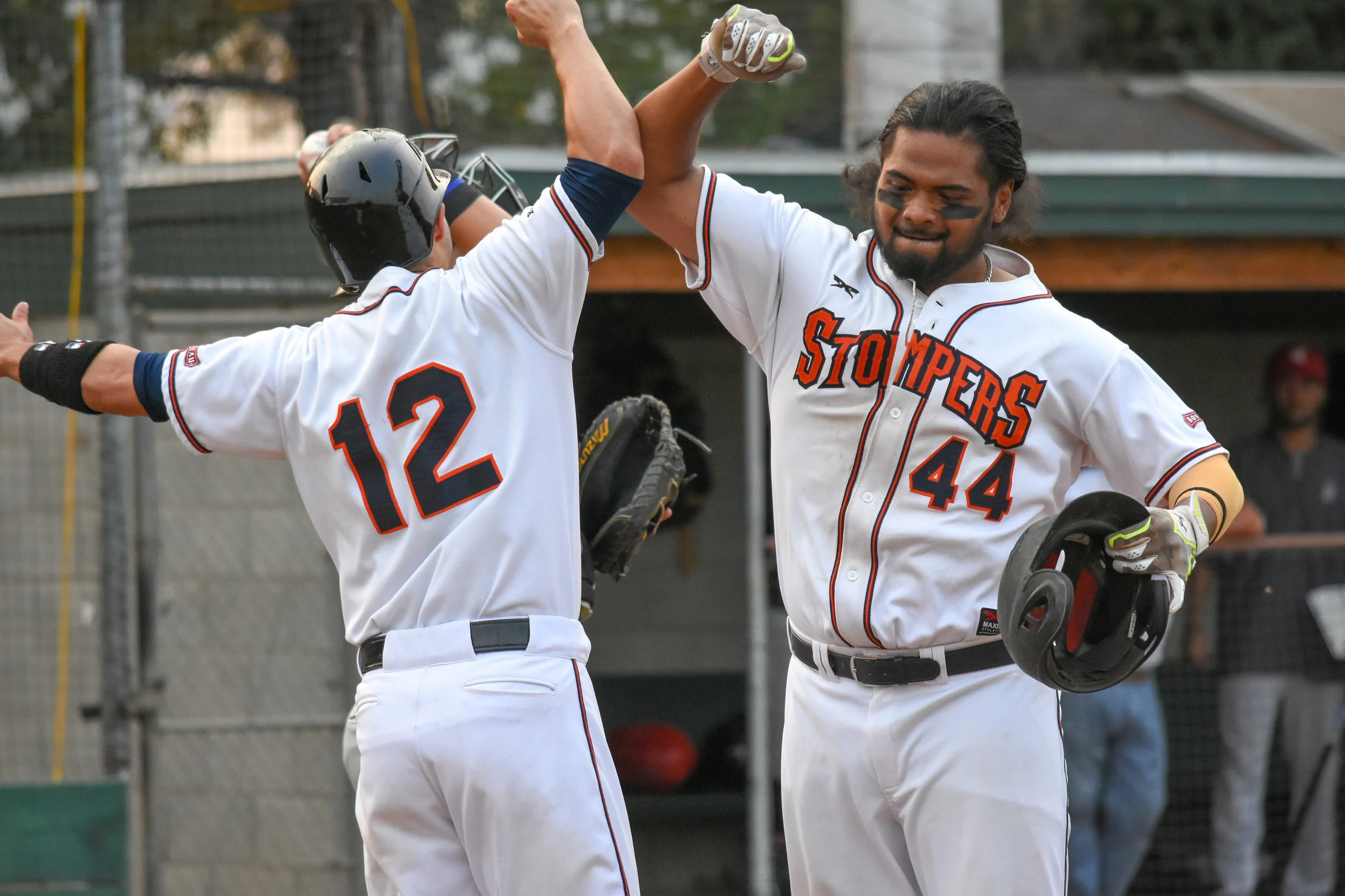 Daniel Baptista (44) is greeted by Kenny Meimerstorf (12) after hitting his second home run of the day in the third inning of the Sonoma Stompers game against the Napa Silverados, August 7, 2018 in Sonoma, Calif.(James W. Toy III / Sonoma Stompers)