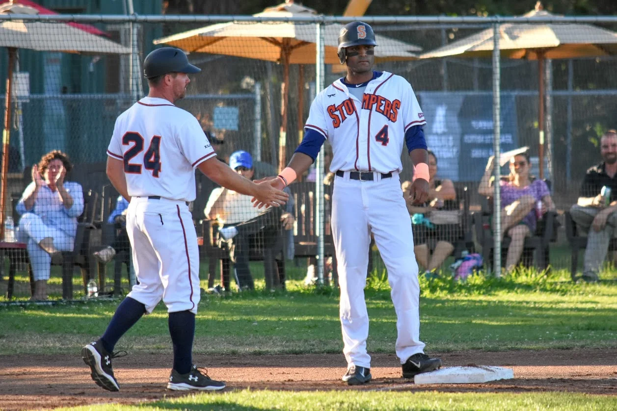 Manager Zack Pace congratulating Marcus Bradley in a home game, 2018 in Sonoma, (James W. Toy III / Sonoma Stompers)