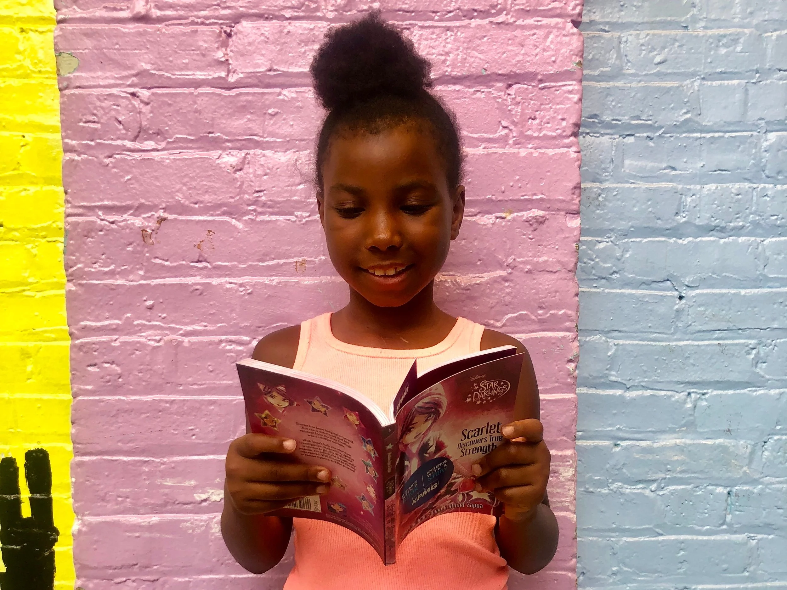 Aniya reads her favorite book this summer.