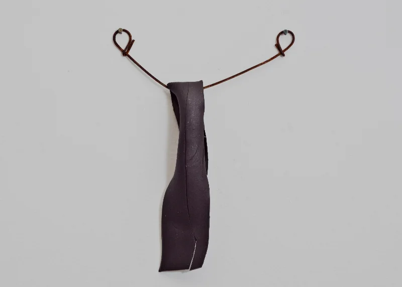 Untitled, 2012-13. Clay, with found materials, 5” x 7” x 1”