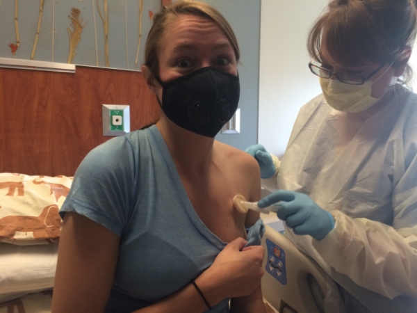 Cleaning the port area before the needle pricks her skin! 