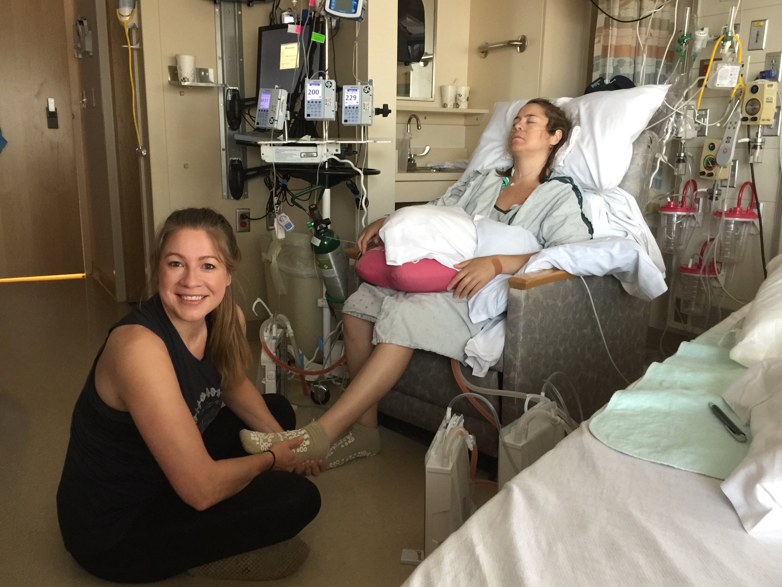 Trying to help her feet