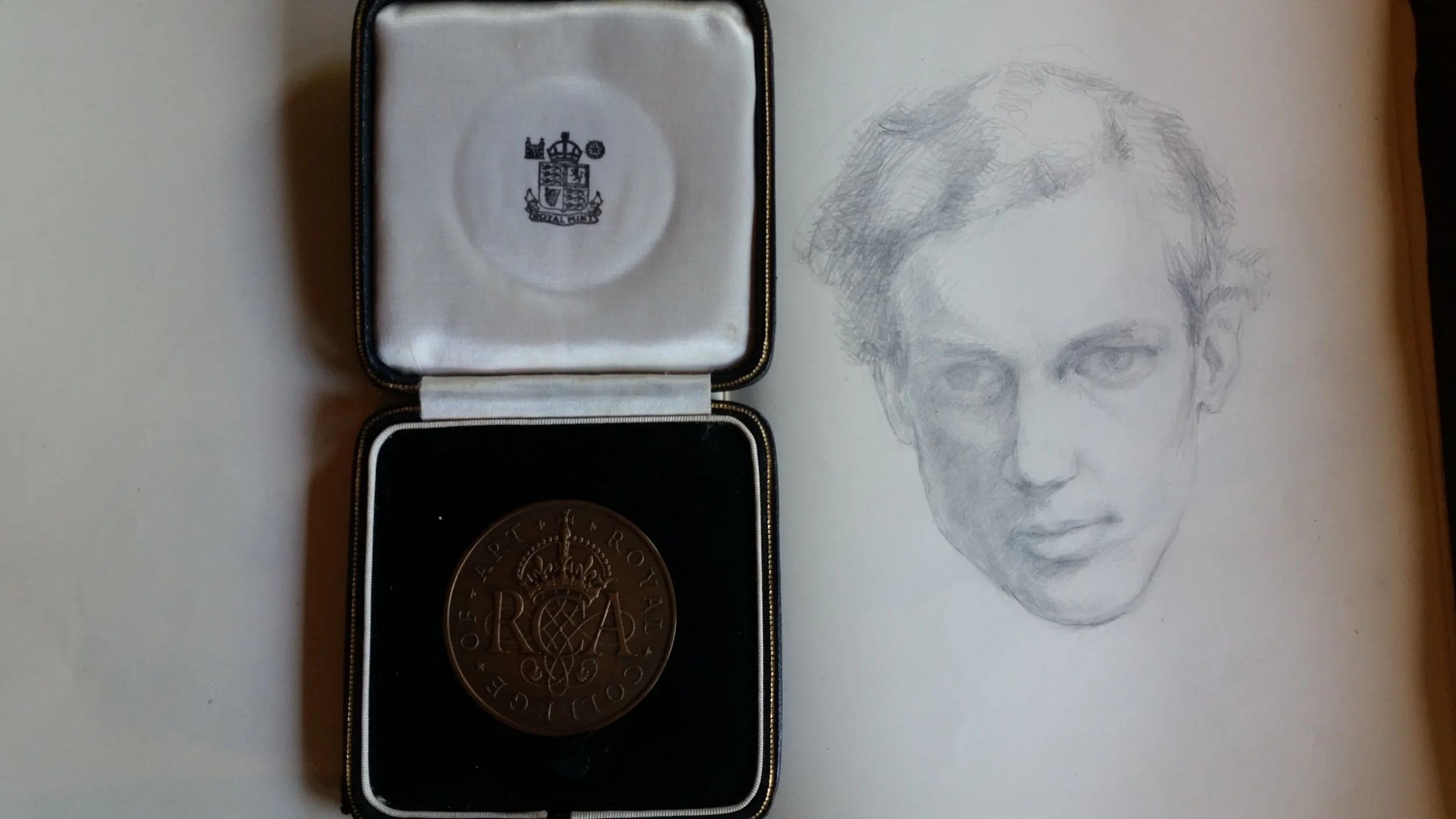 Medal awarded to A.D. for Work of Special Distinction, 1954 (left), Selft portrait from sketchbook, 1951 (right)