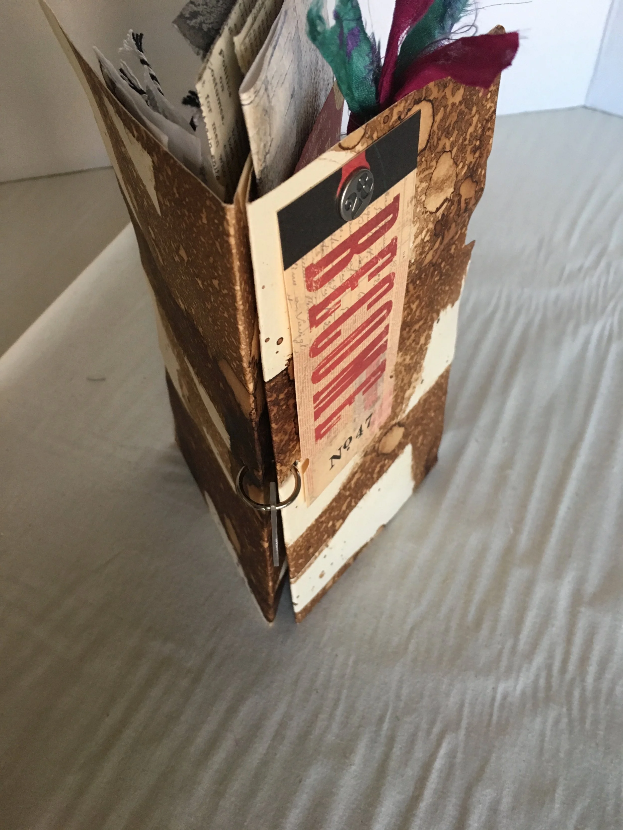 Tall journal with pockets, tabs and embellishment