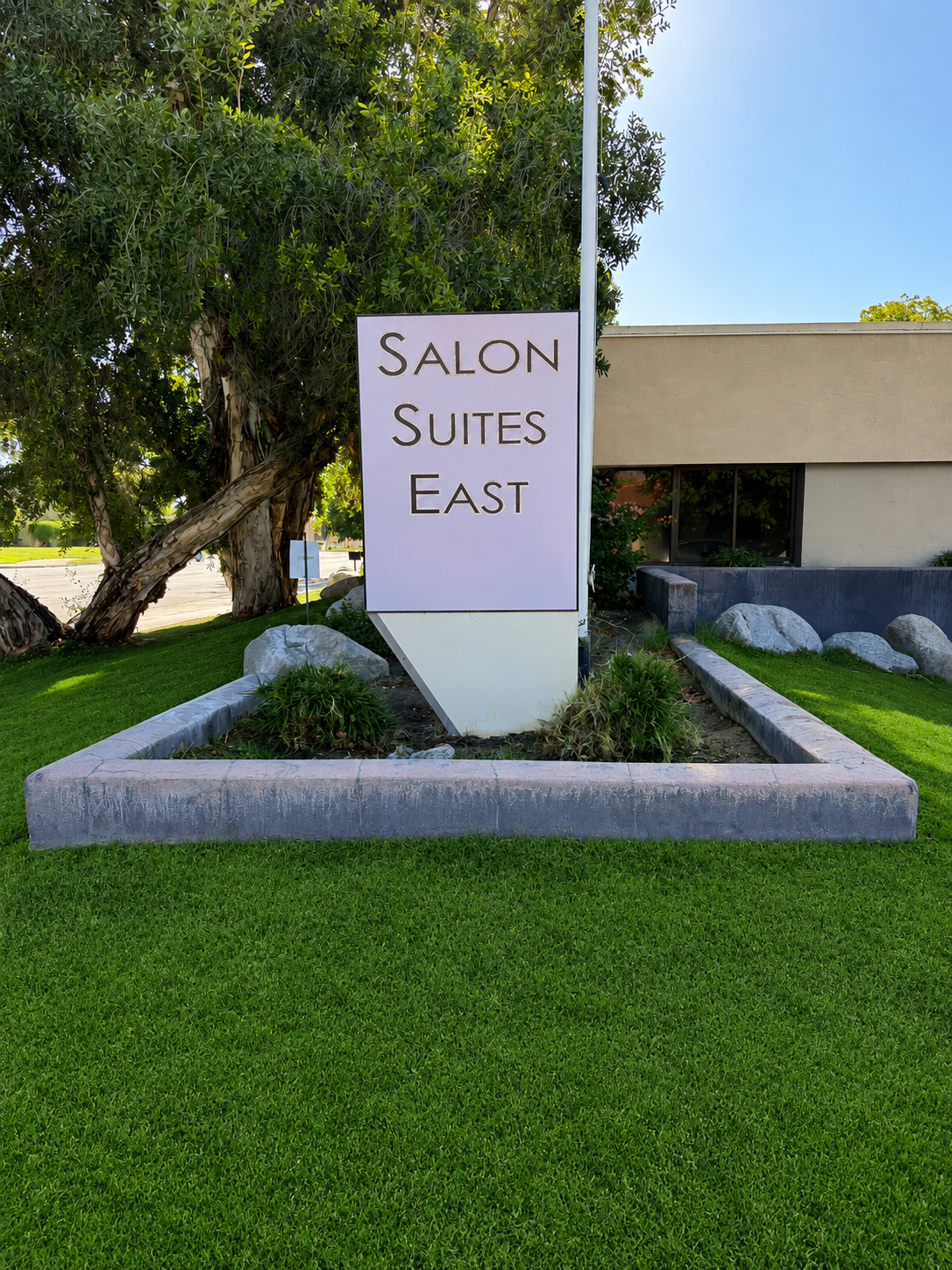 Exterior view of Salon Suites East in Palm Springs, California, home to Rudy The Hair Artist, a private salon studio specializing in precision haircuts, Schwarzkopf professional hair color, and personalized hair care.